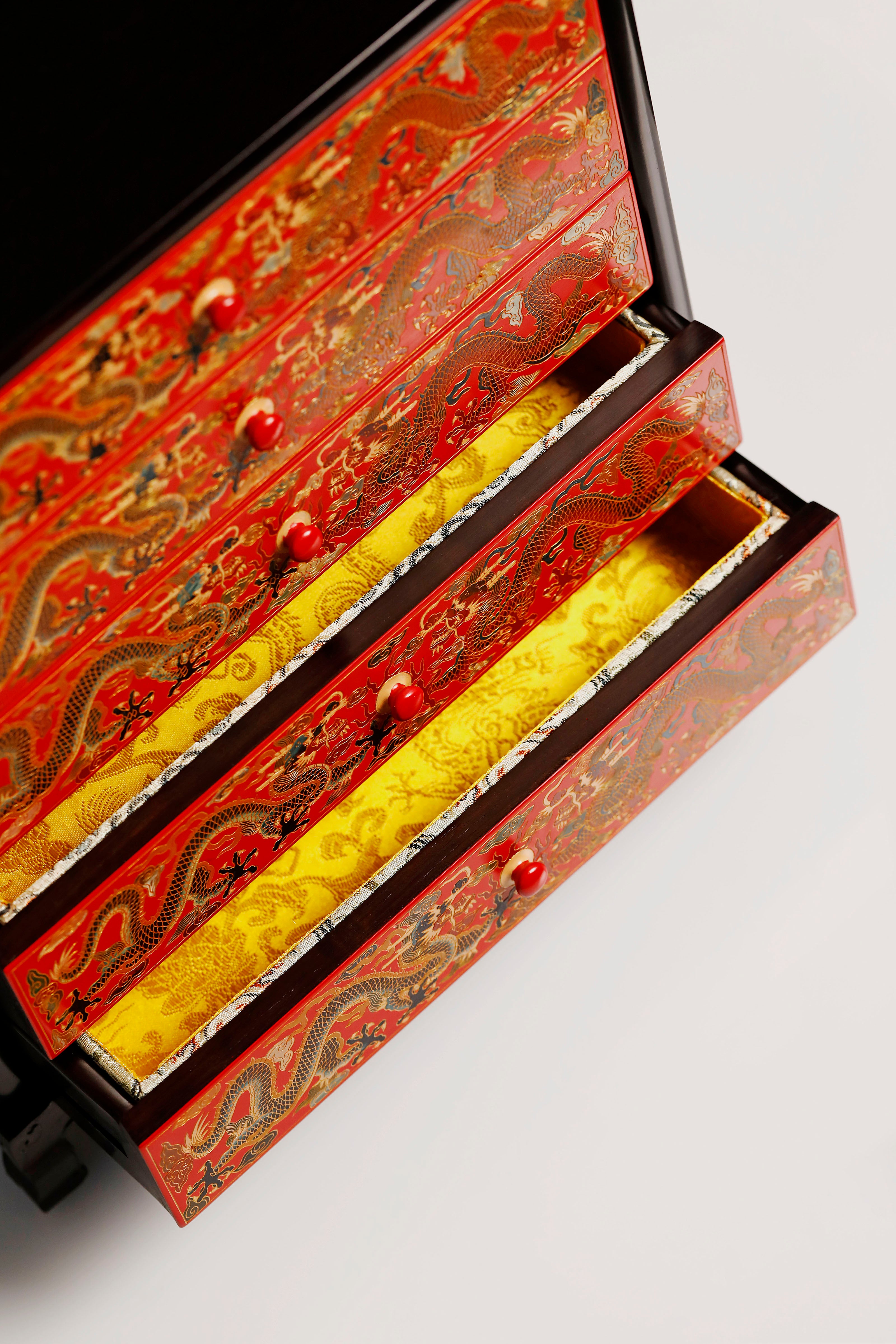 Purple sandalwood lacquer table with double dragons playing with a pearl, five-tiered tea cabinet