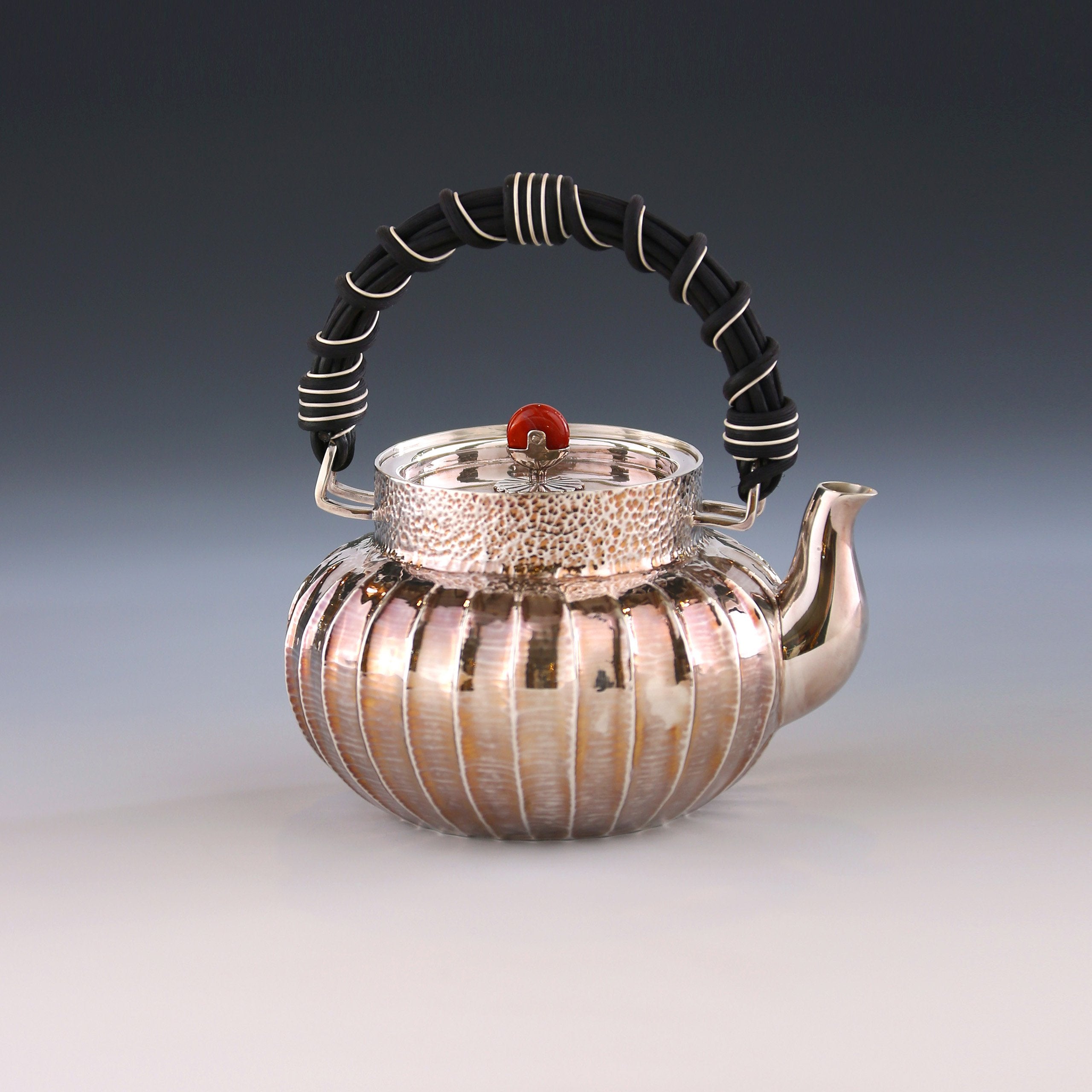 Lantern-shaped wicker handle sterling silver teapot