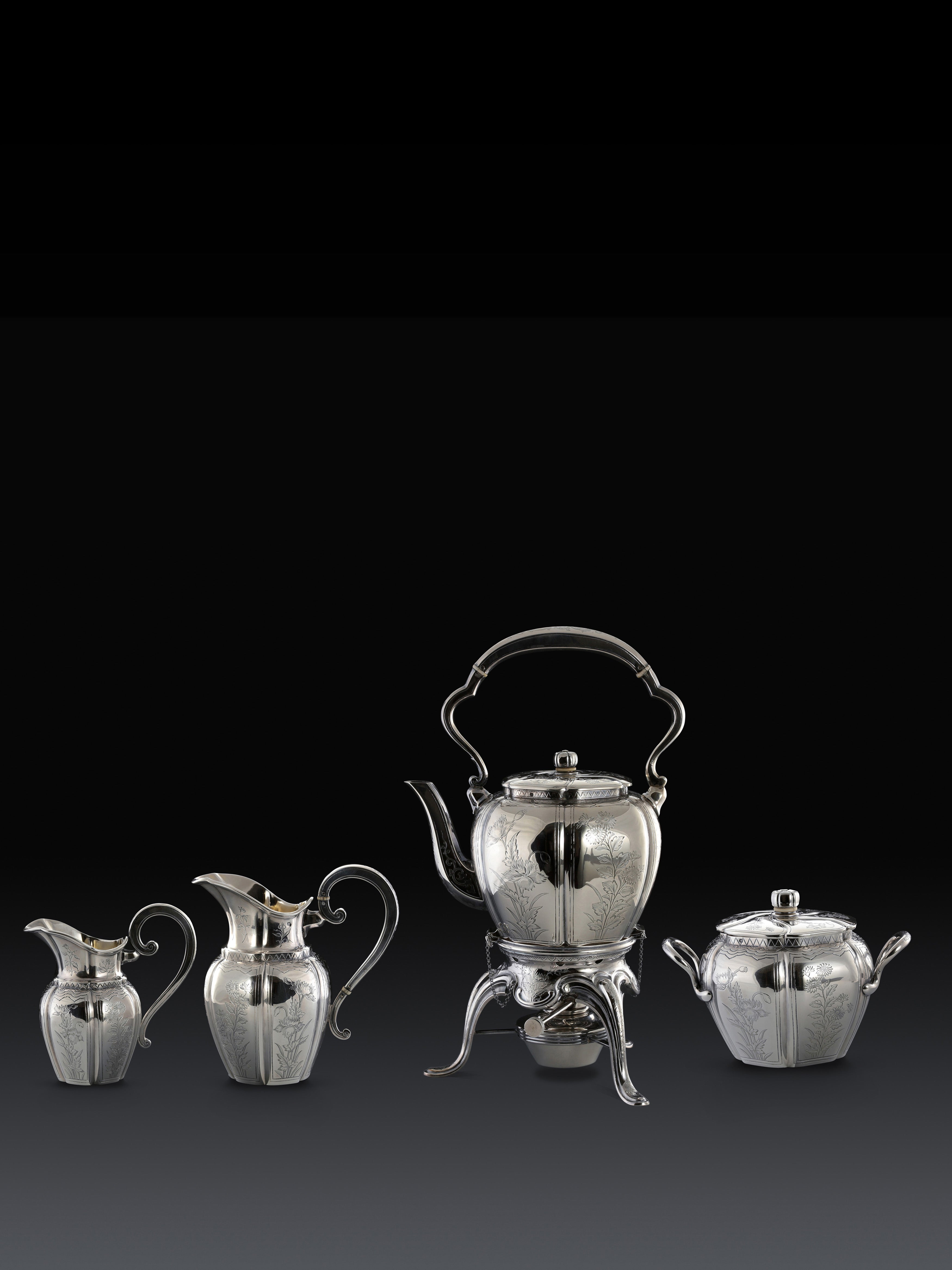 A set of 19th-century French sterling silver tea set featuring a swirling palm leaf pattern.