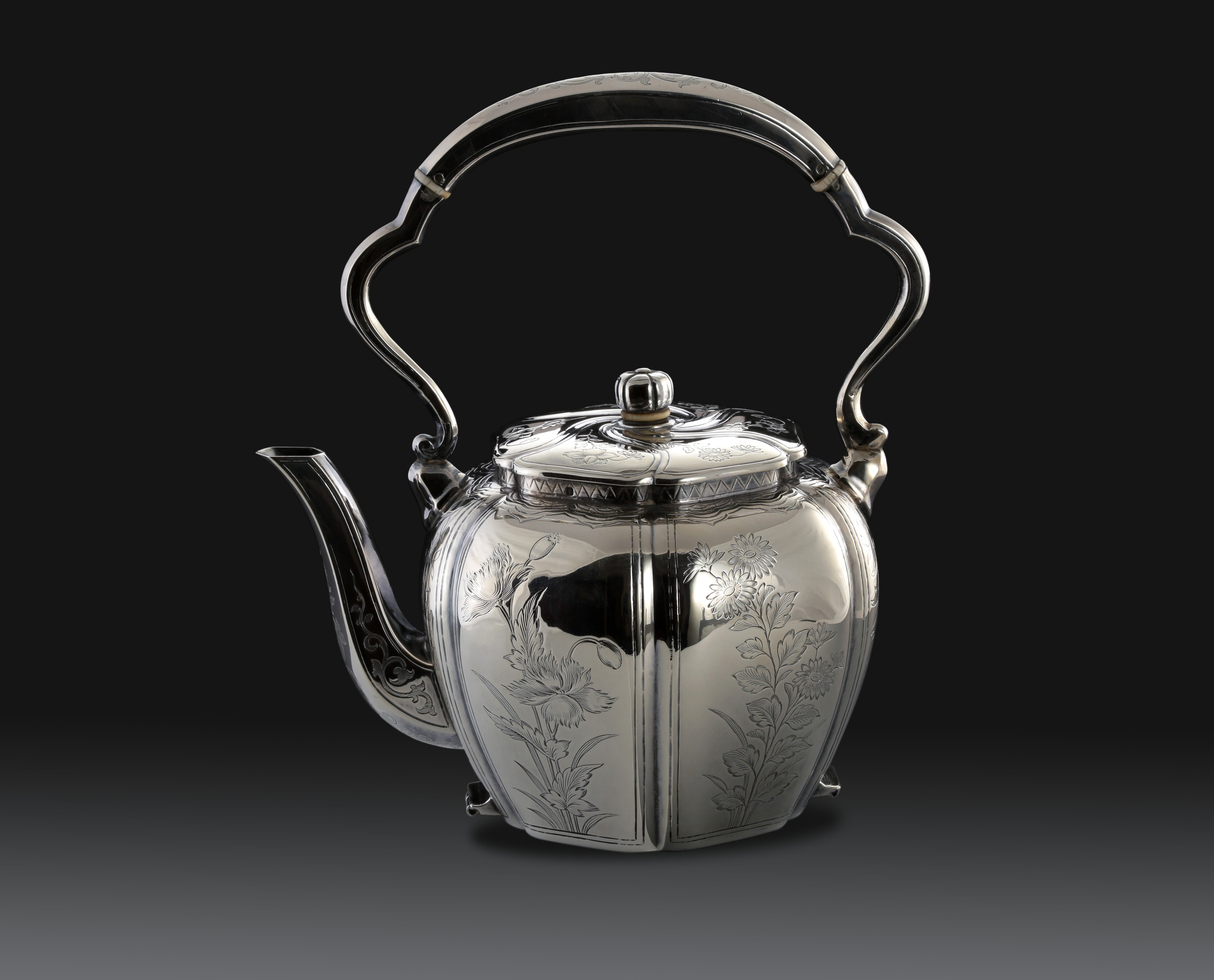 A set of 19th-century French sterling silver tea set featuring a swirling palm leaf pattern.