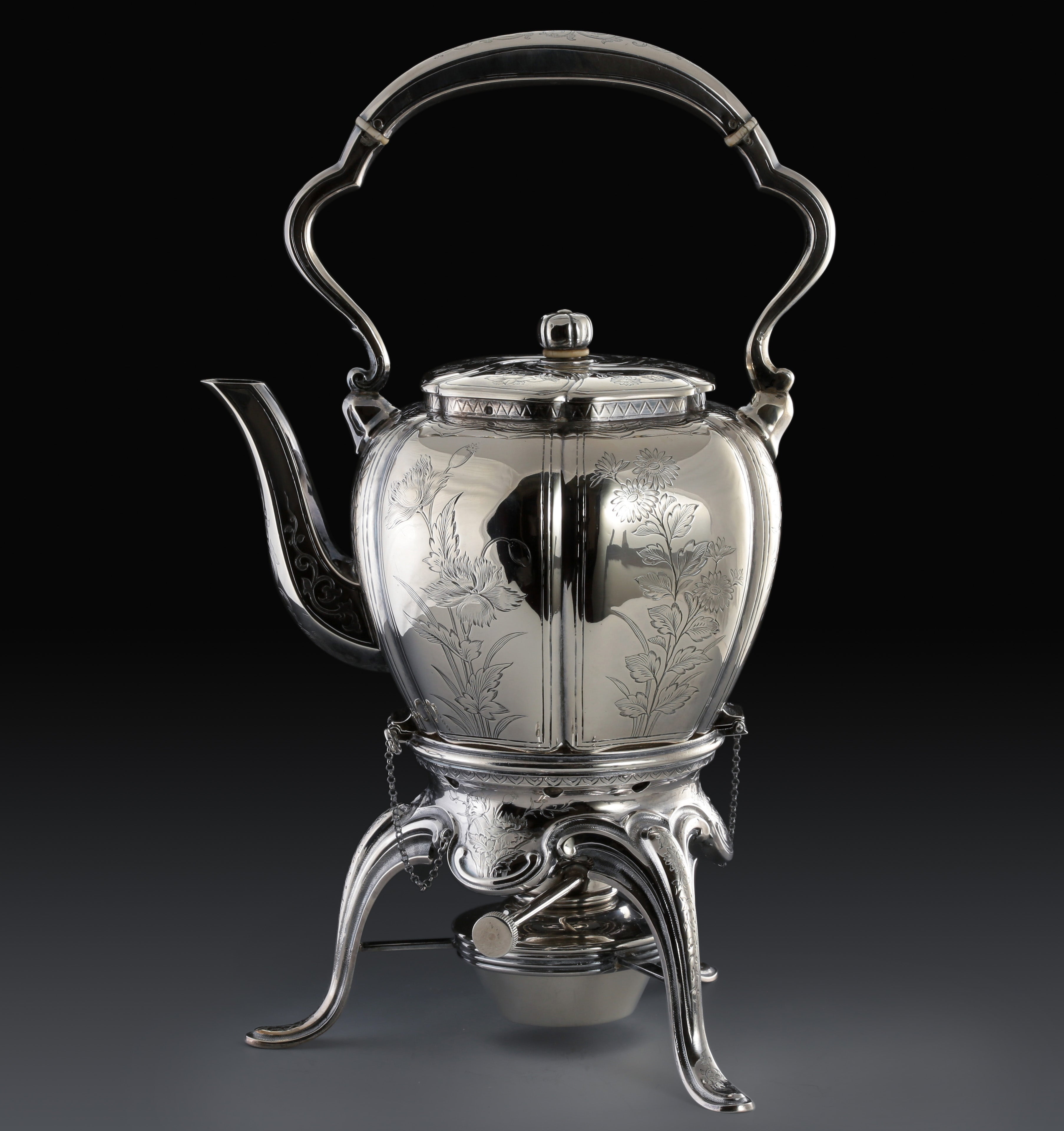 A set of 19th-century French sterling silver tea set featuring a swirling palm leaf pattern.