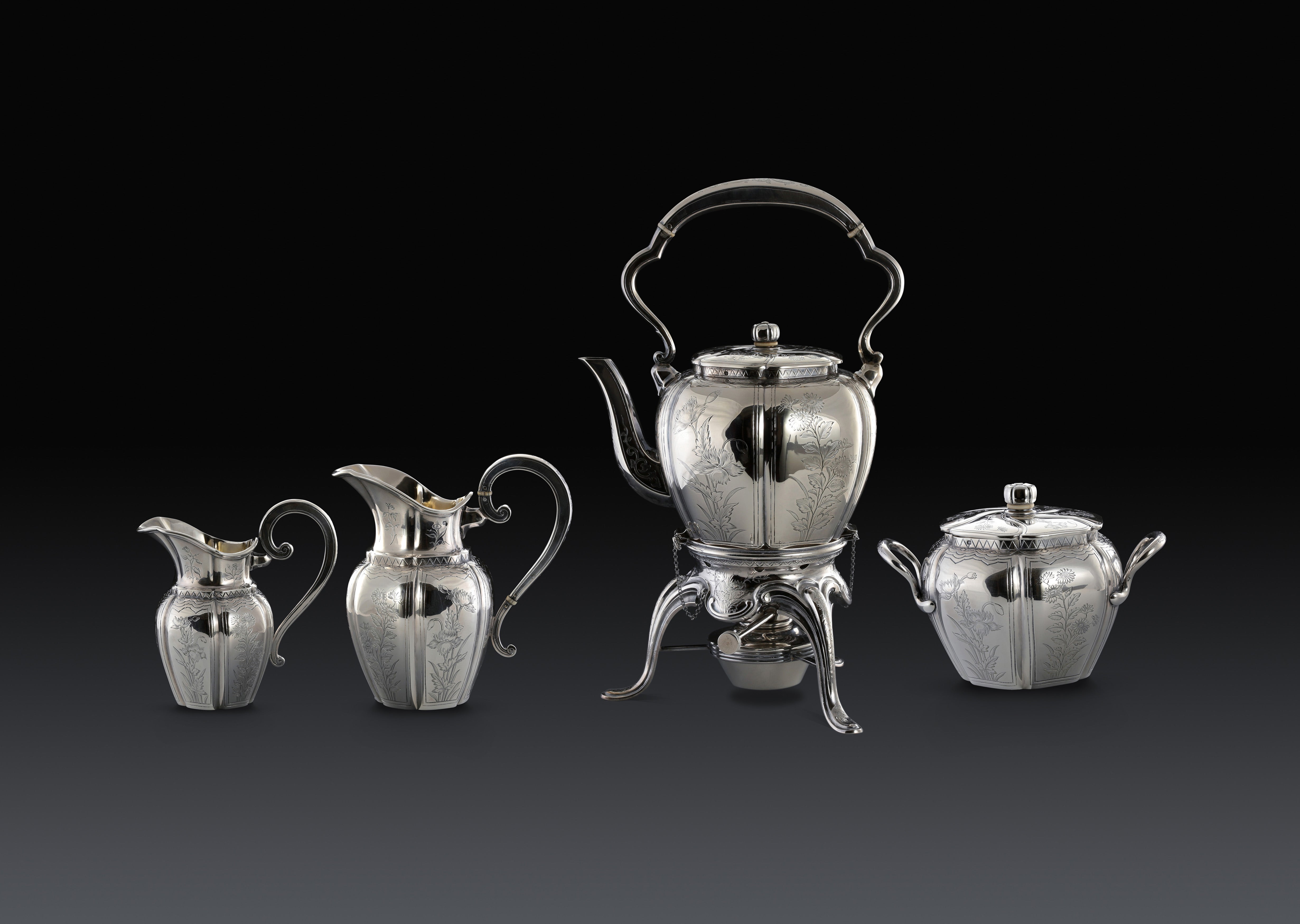 A set of 19th-century French sterling silver tea set featuring a swirling palm leaf pattern.