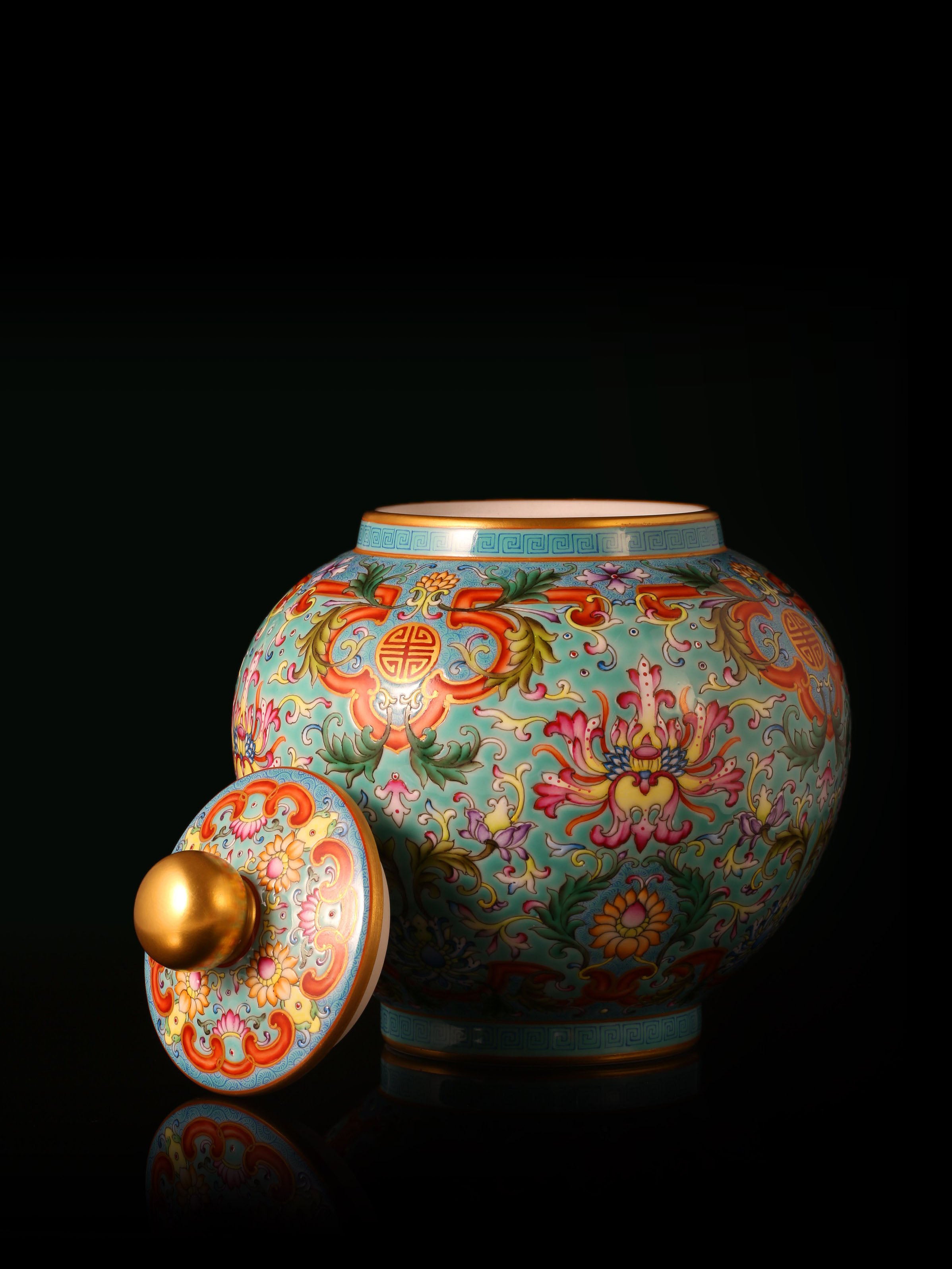 Enamel-painted lotus flower pattern, iron-red ruyi frame, tea canister