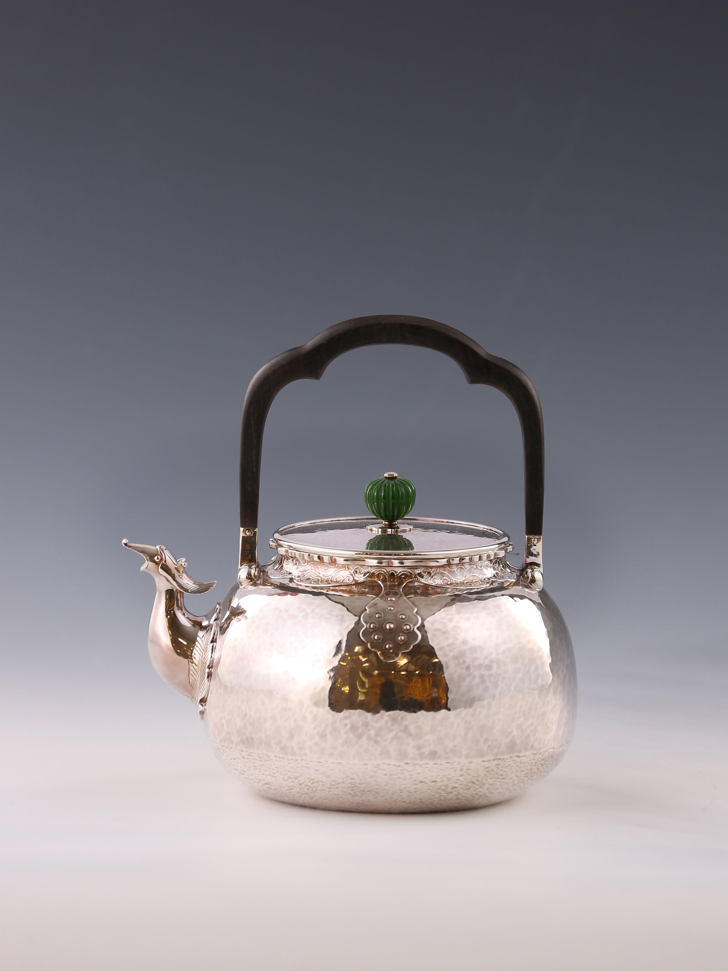 Silver ewer with phoenix head and cloud shoulder design