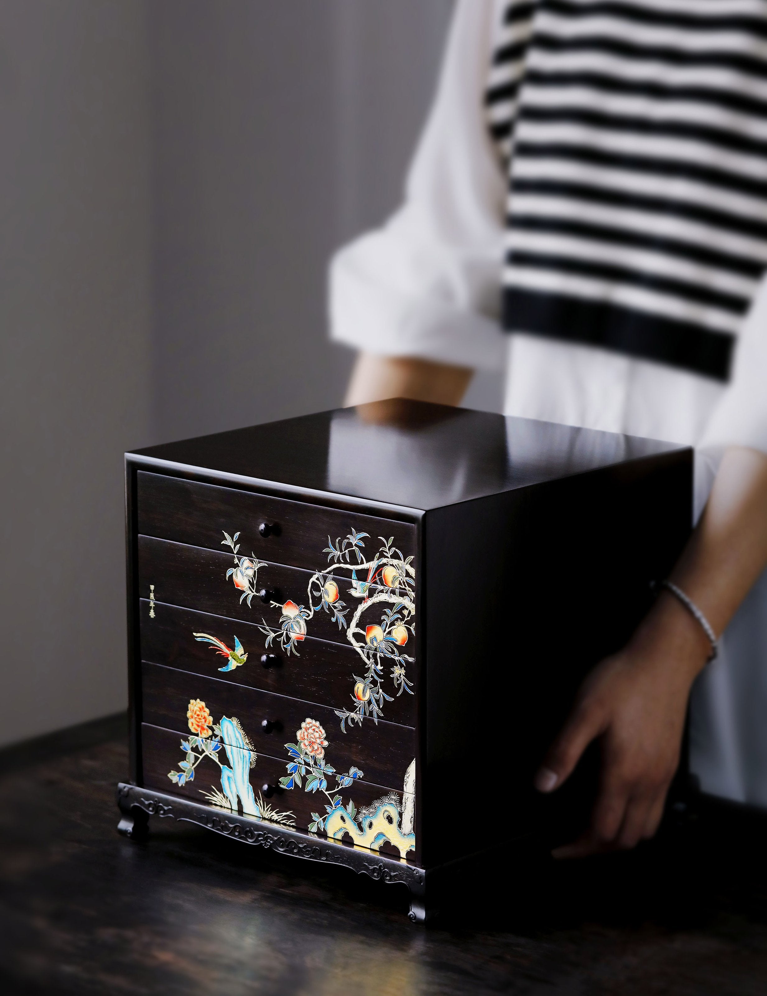 Gold piled high, joy on eyebrows / Wealth and good fortune on the table, five cups of tea on the sideboard