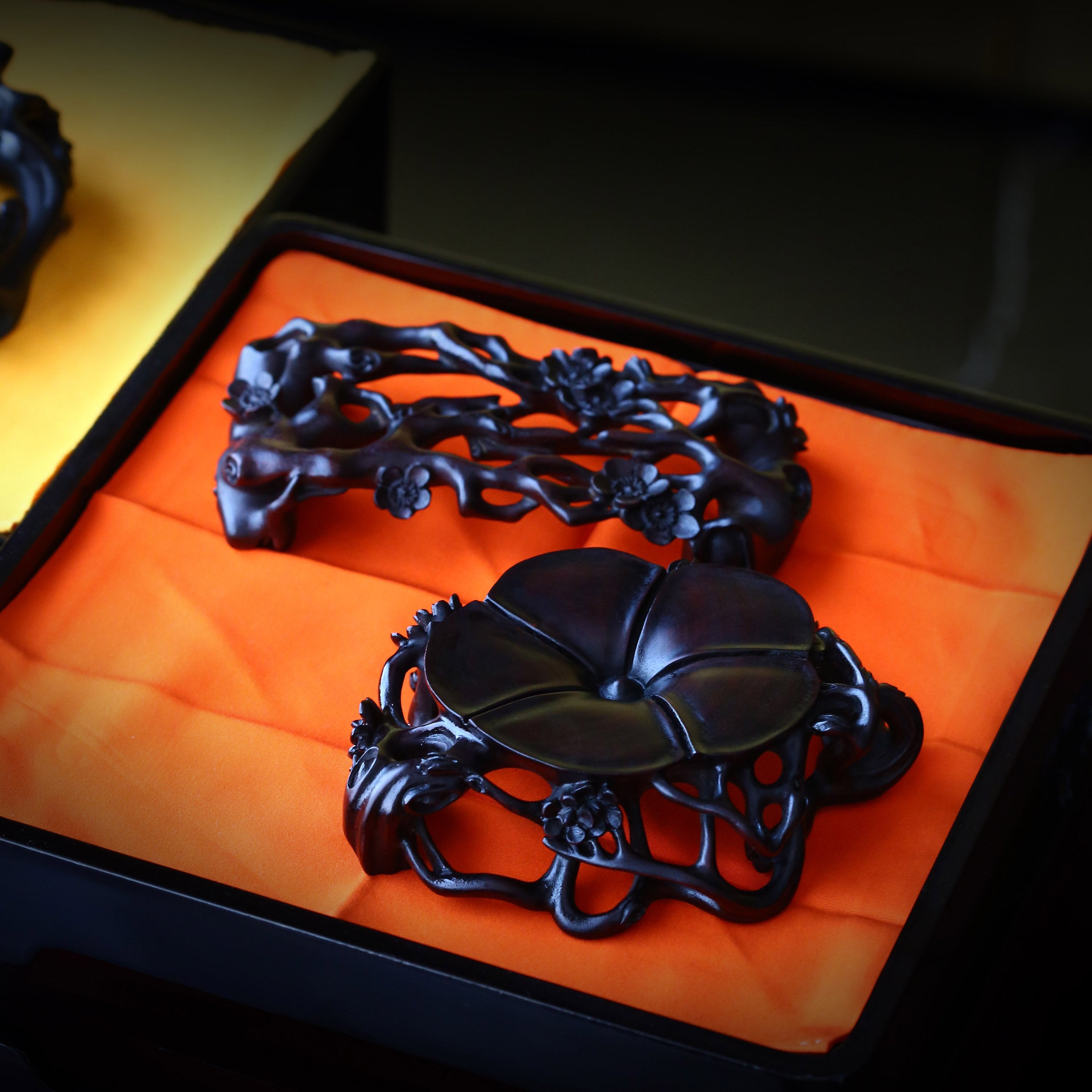 Three pieces with rosewood base featuring plum blossom, lingzhi, and begonia patterns.