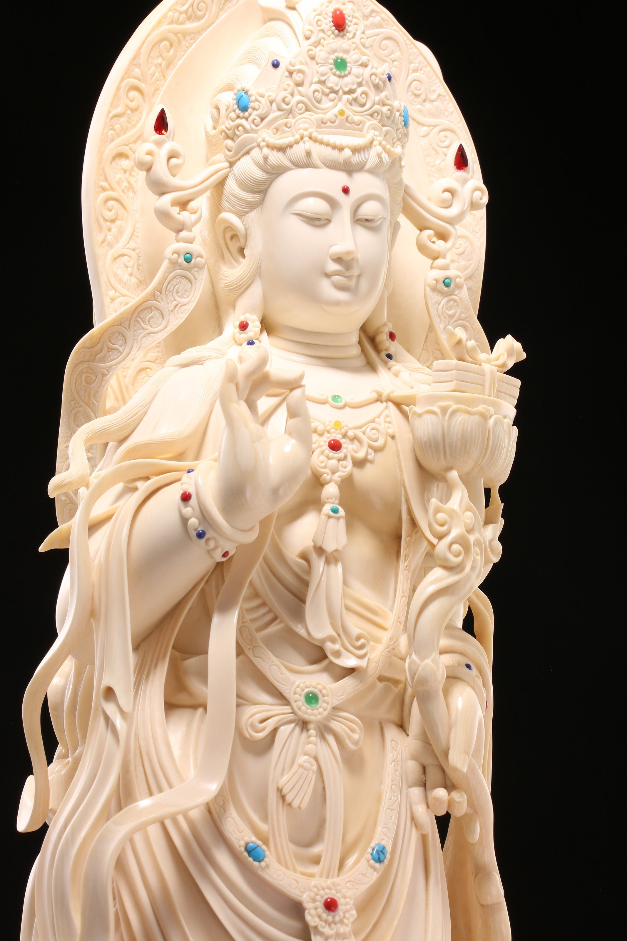 Guanyin holding a lotus and riding a dragon