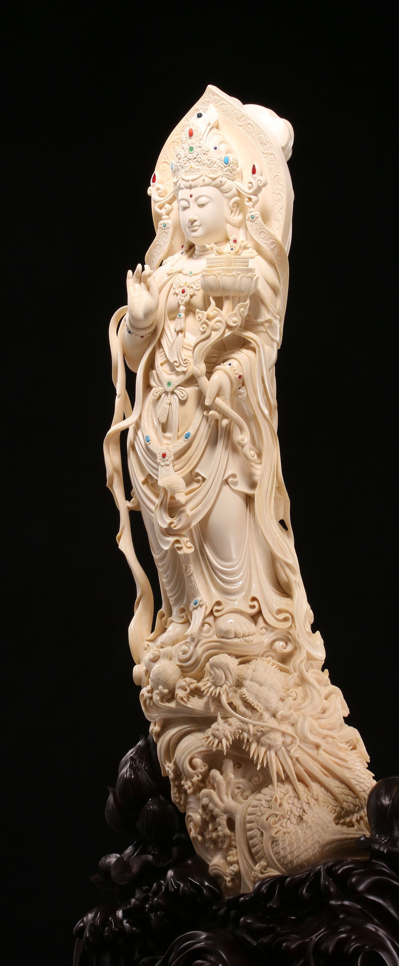 Guanyin holding a lotus and riding a dragon