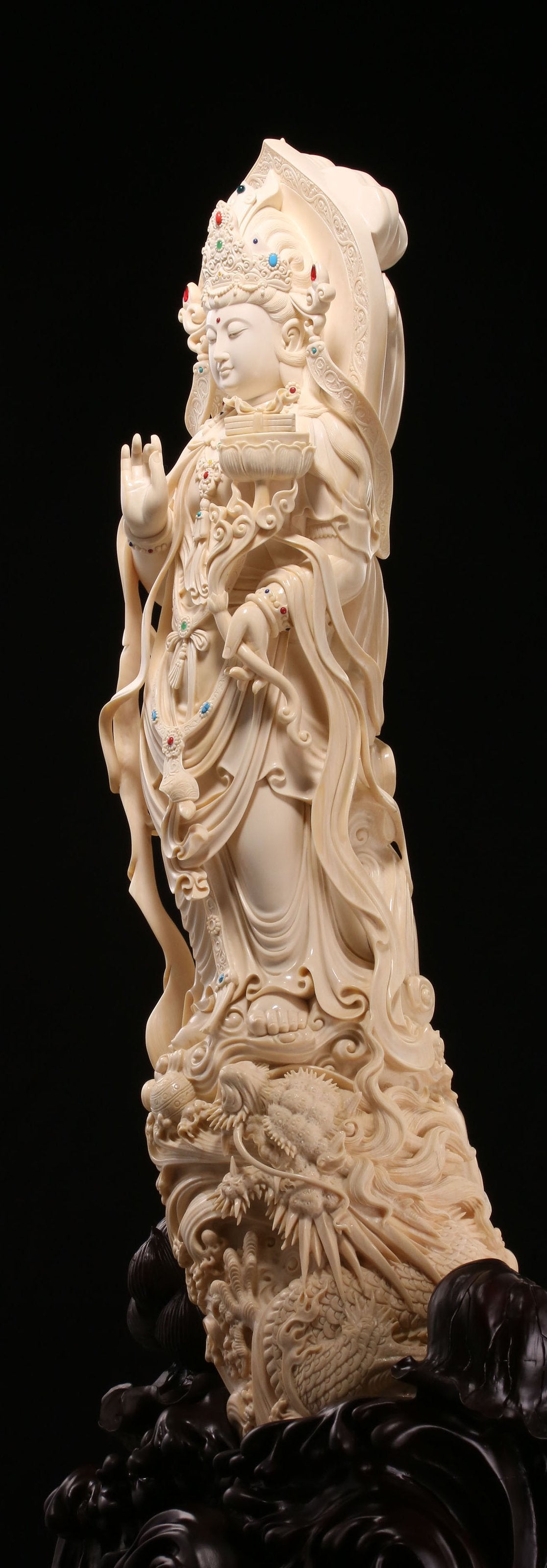 Guanyin holding a lotus and riding a dragon