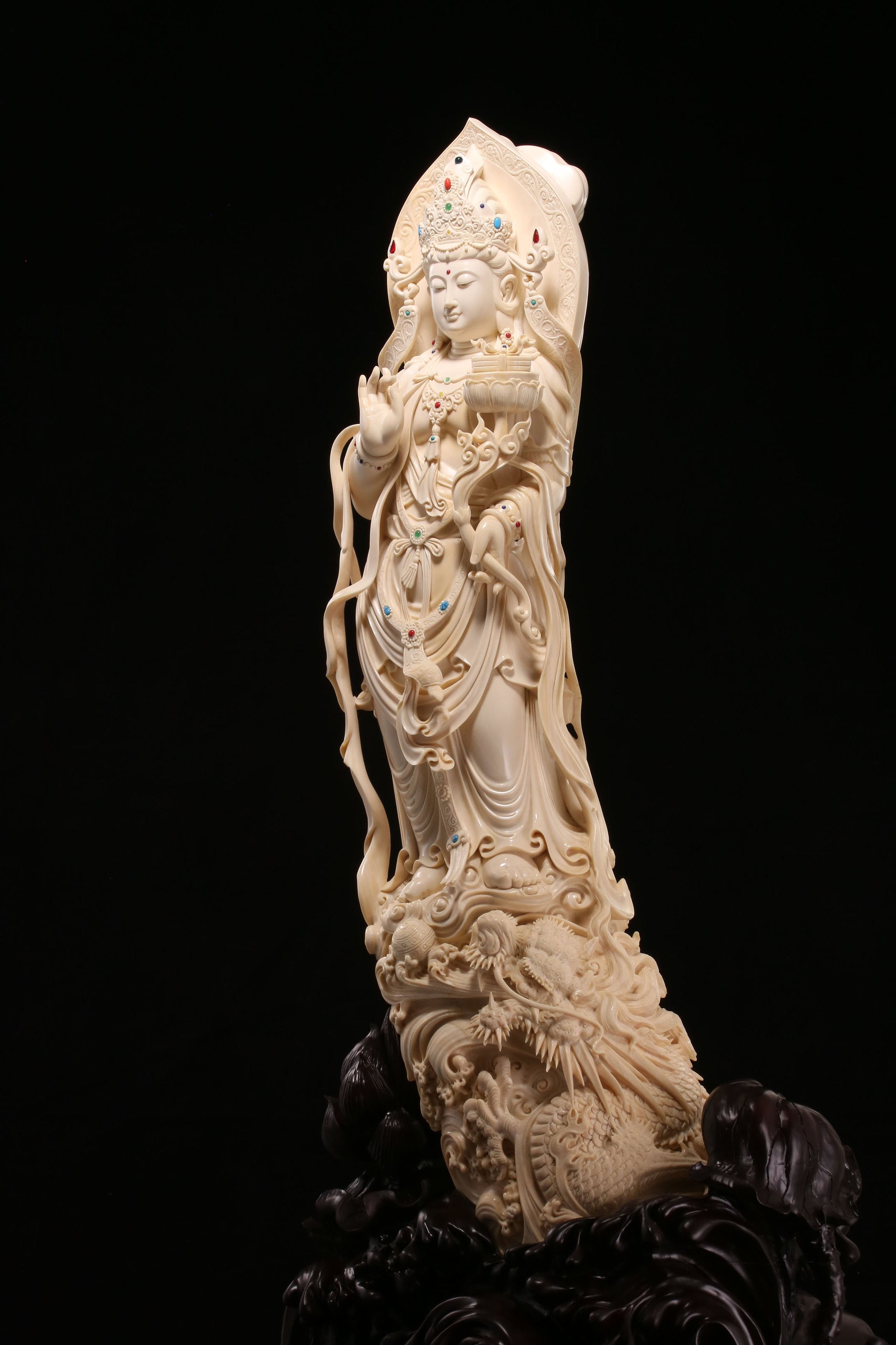 Guanyin holding a lotus and riding a dragon