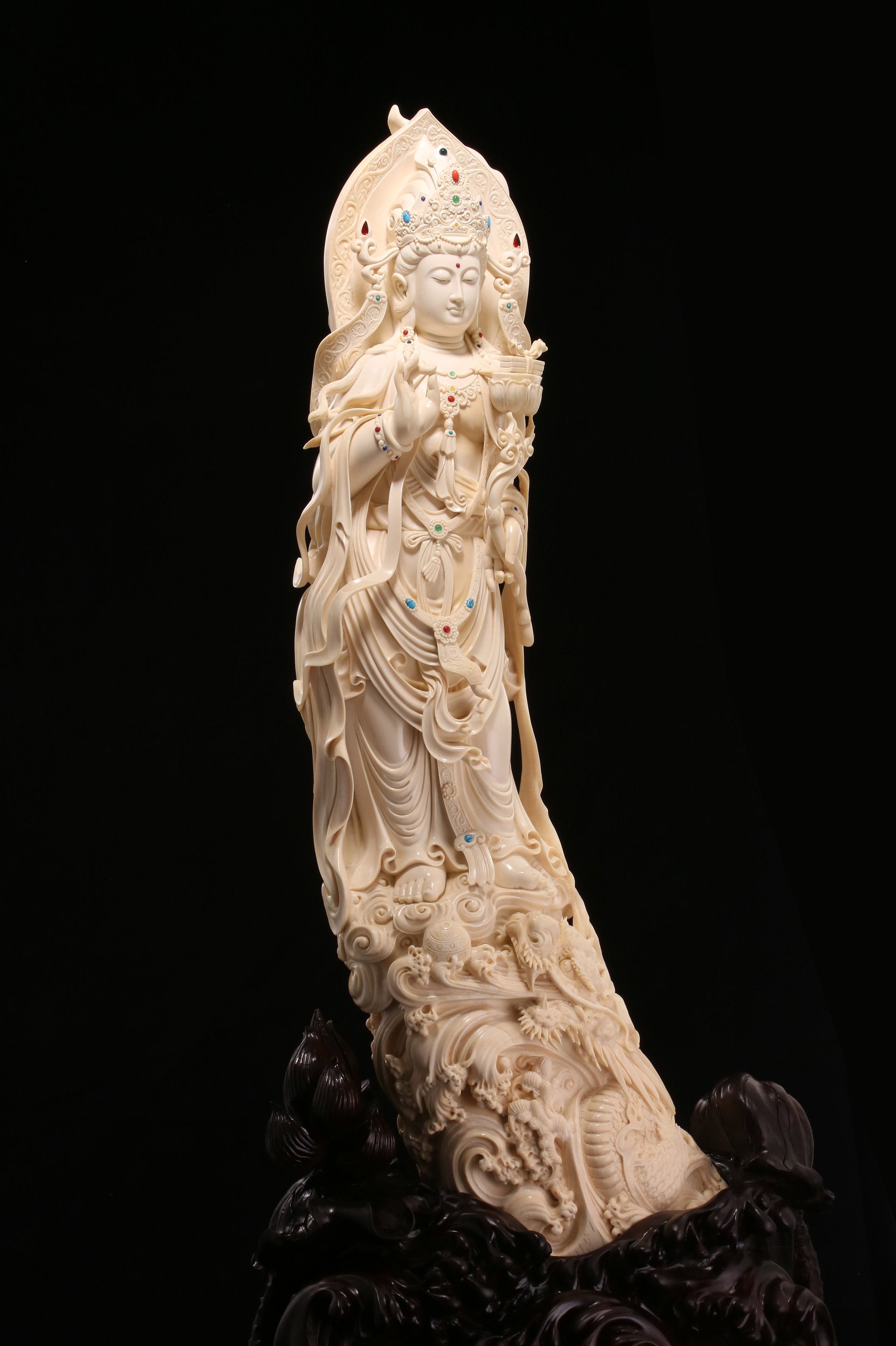 Guanyin holding a lotus and riding a dragon