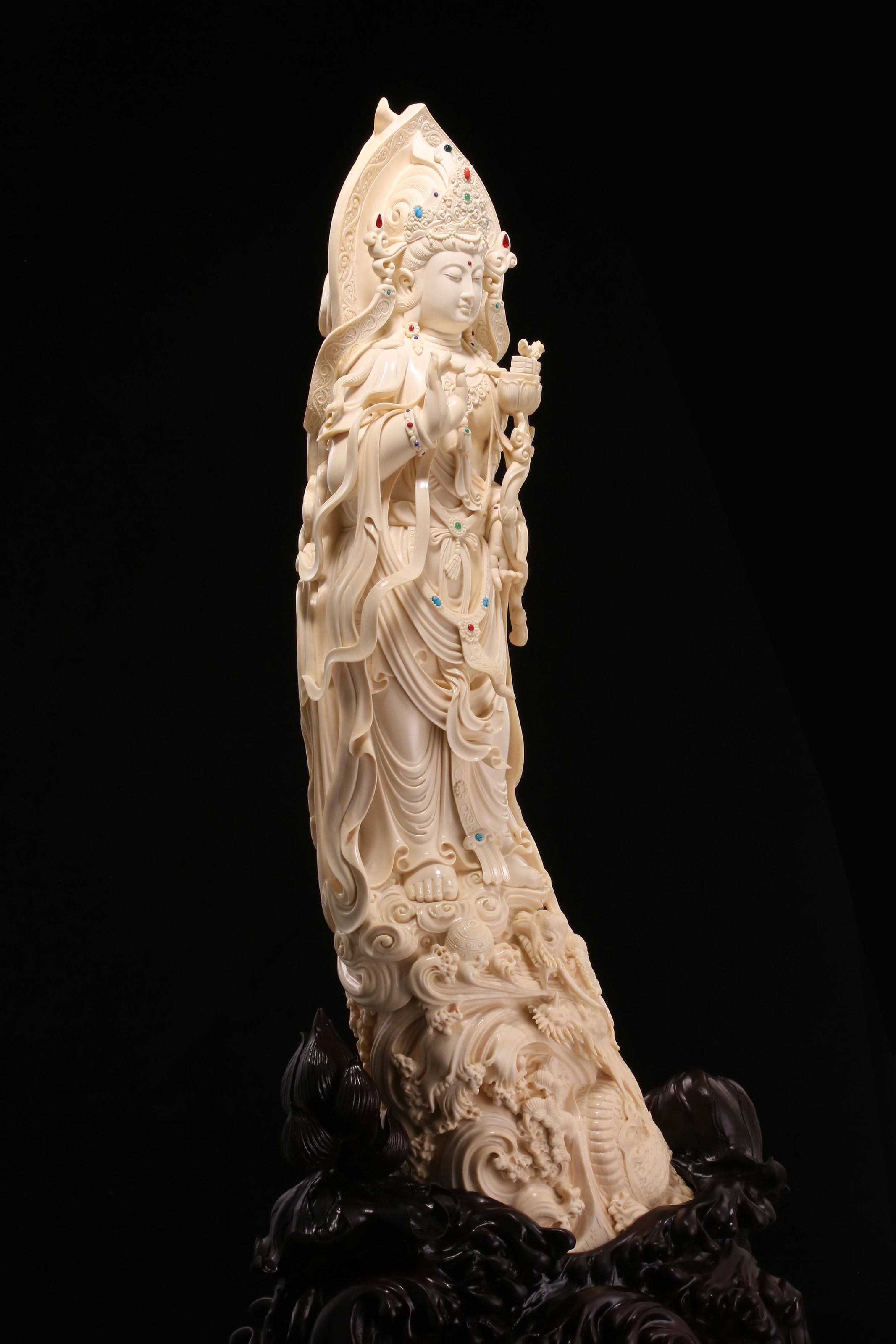 Guanyin holding a lotus and riding a dragon