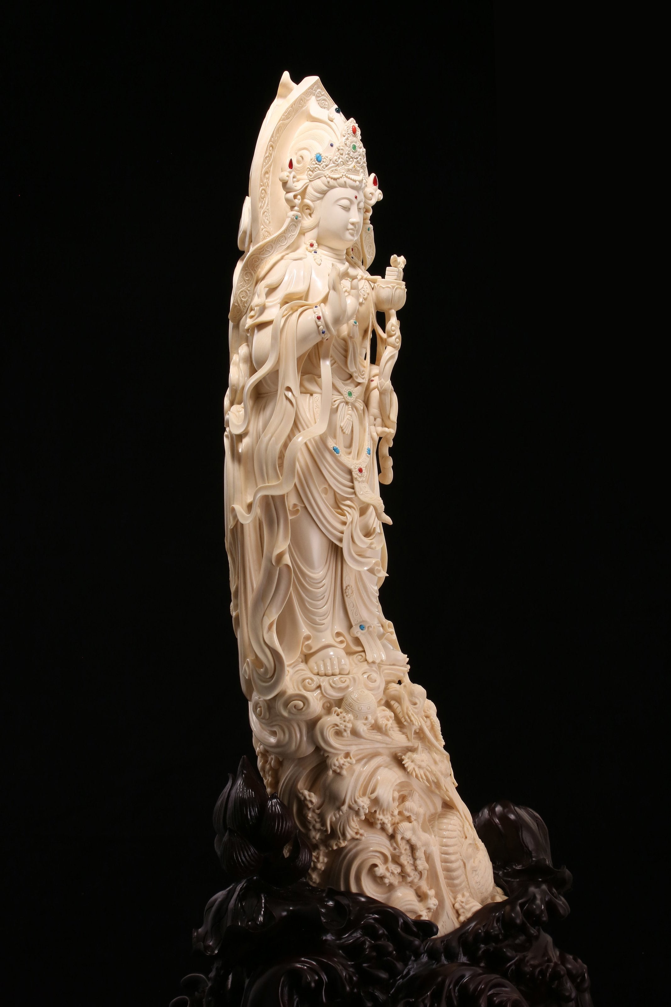 Guanyin holding a lotus and riding a dragon