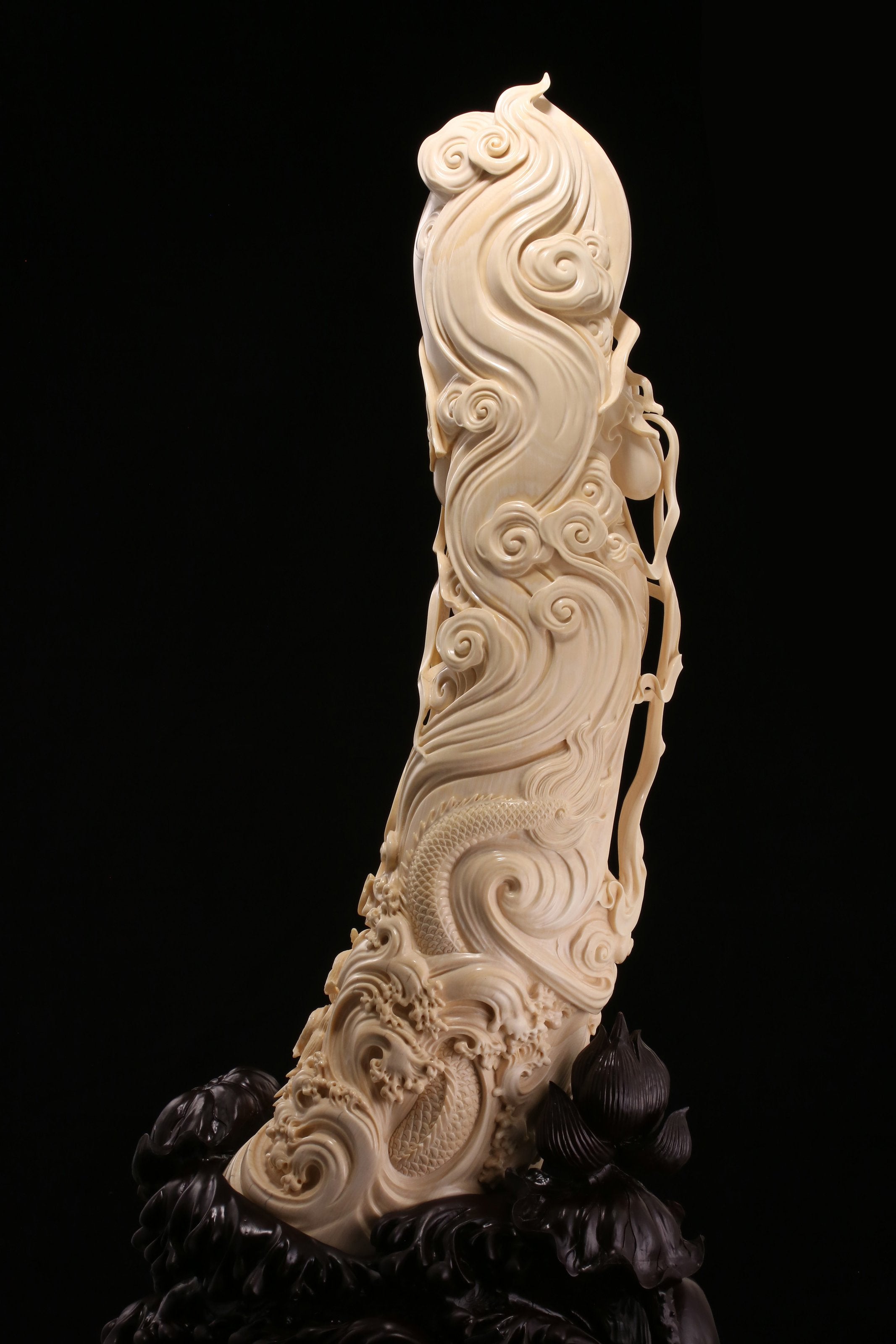 Guanyin holding a lotus and riding a dragon