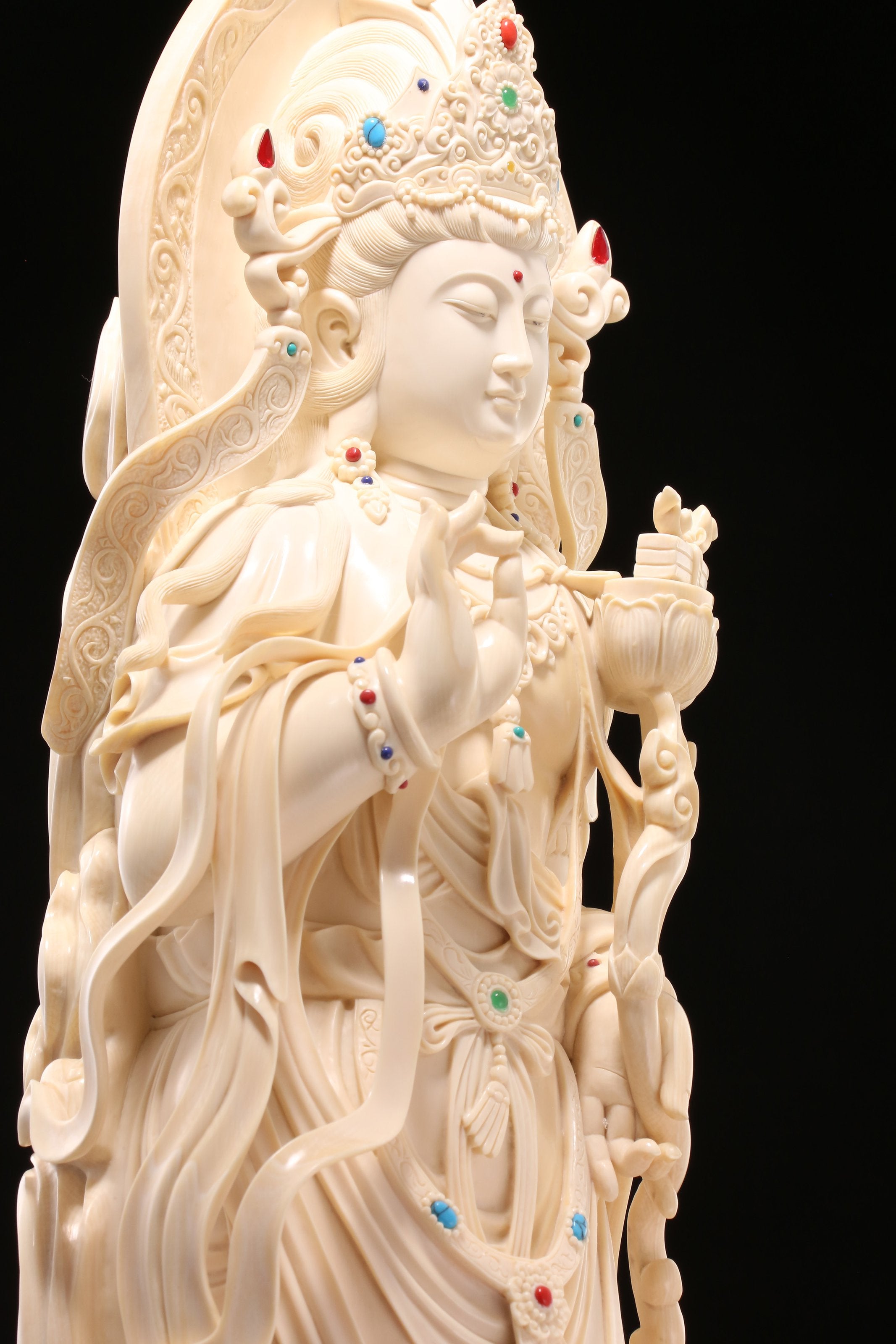 Guanyin holding a lotus and riding a dragon