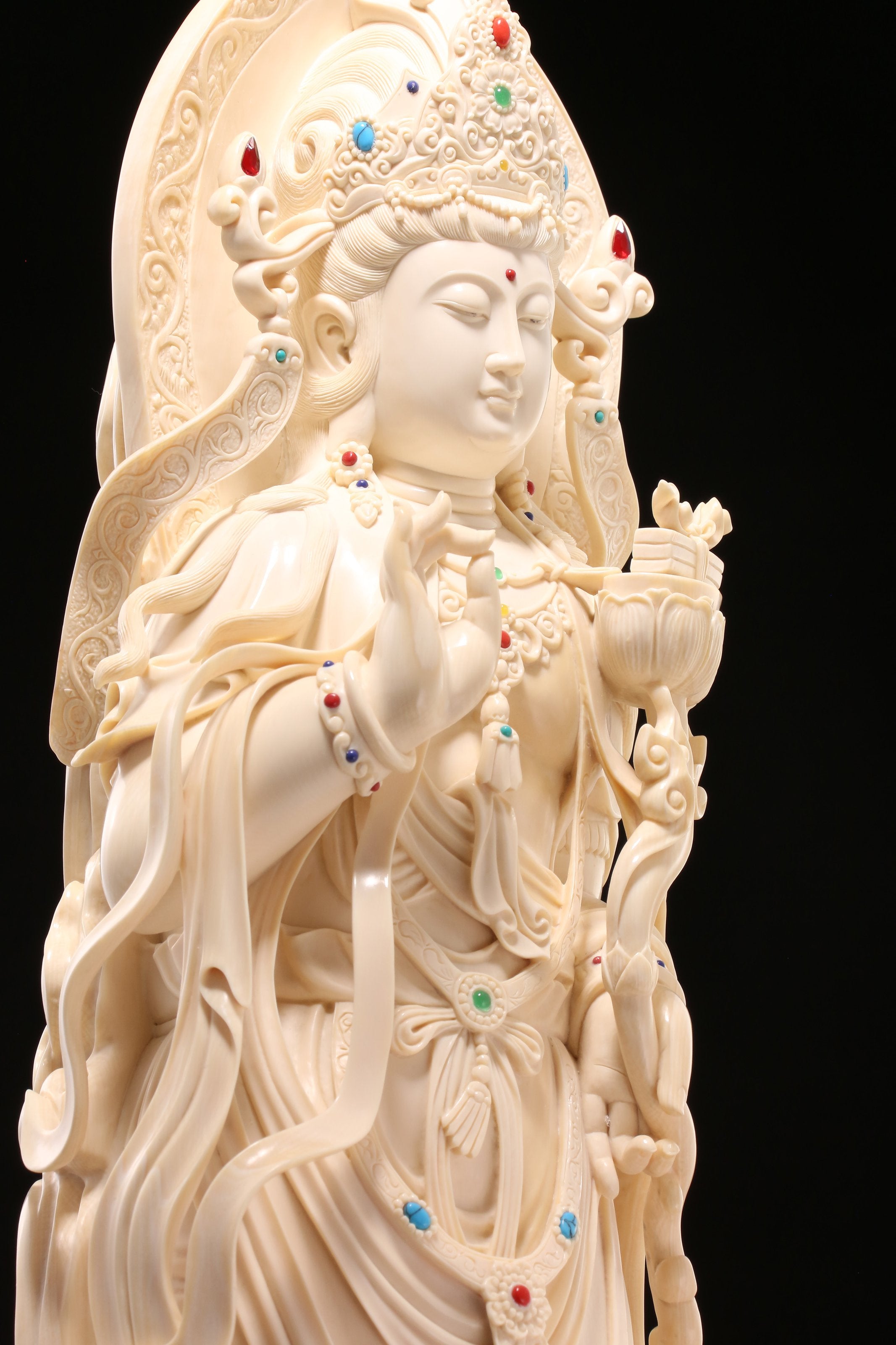 Guanyin holding a lotus and riding a dragon