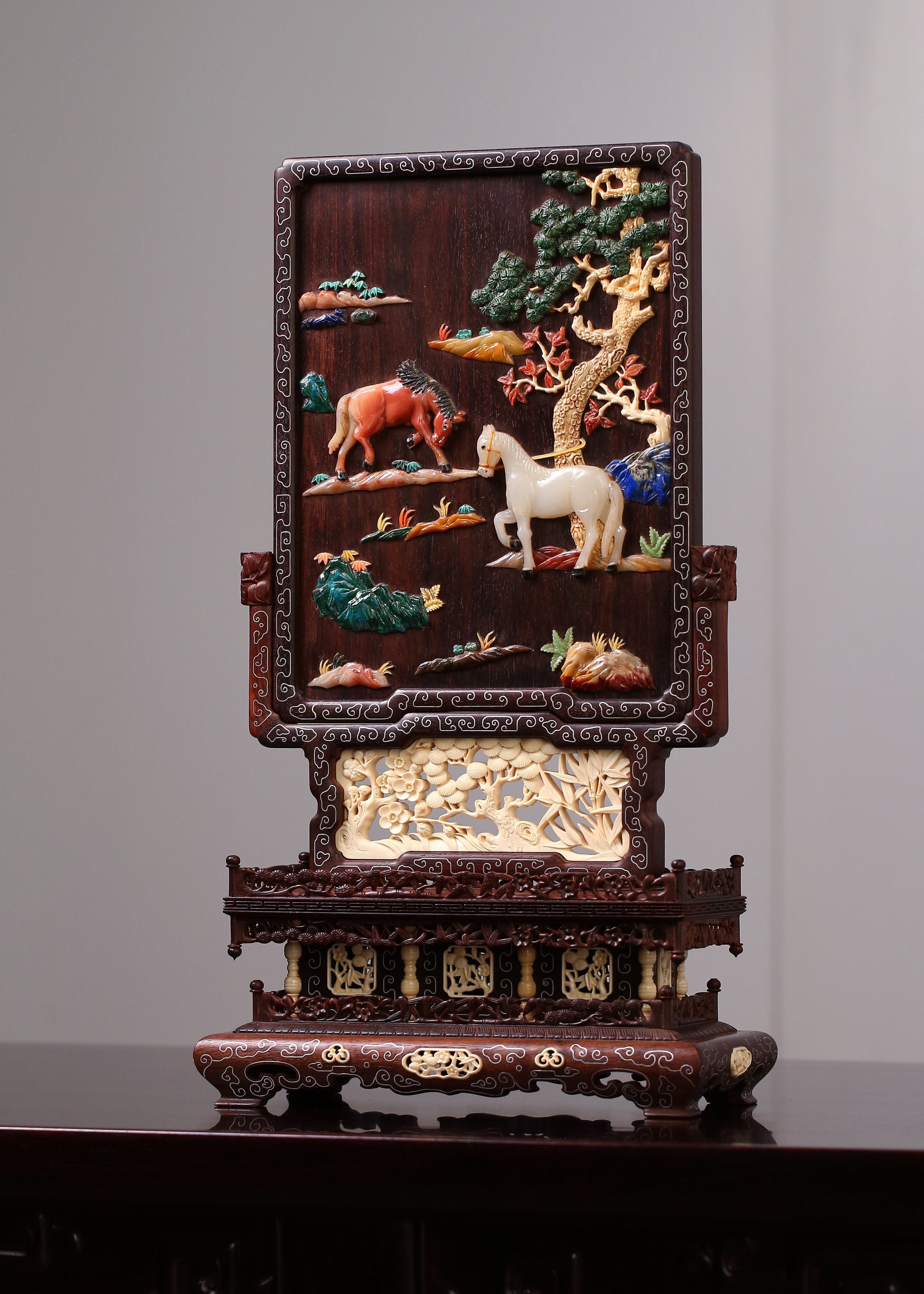 Rosewood screen inlaid with precious stones and silver filigree