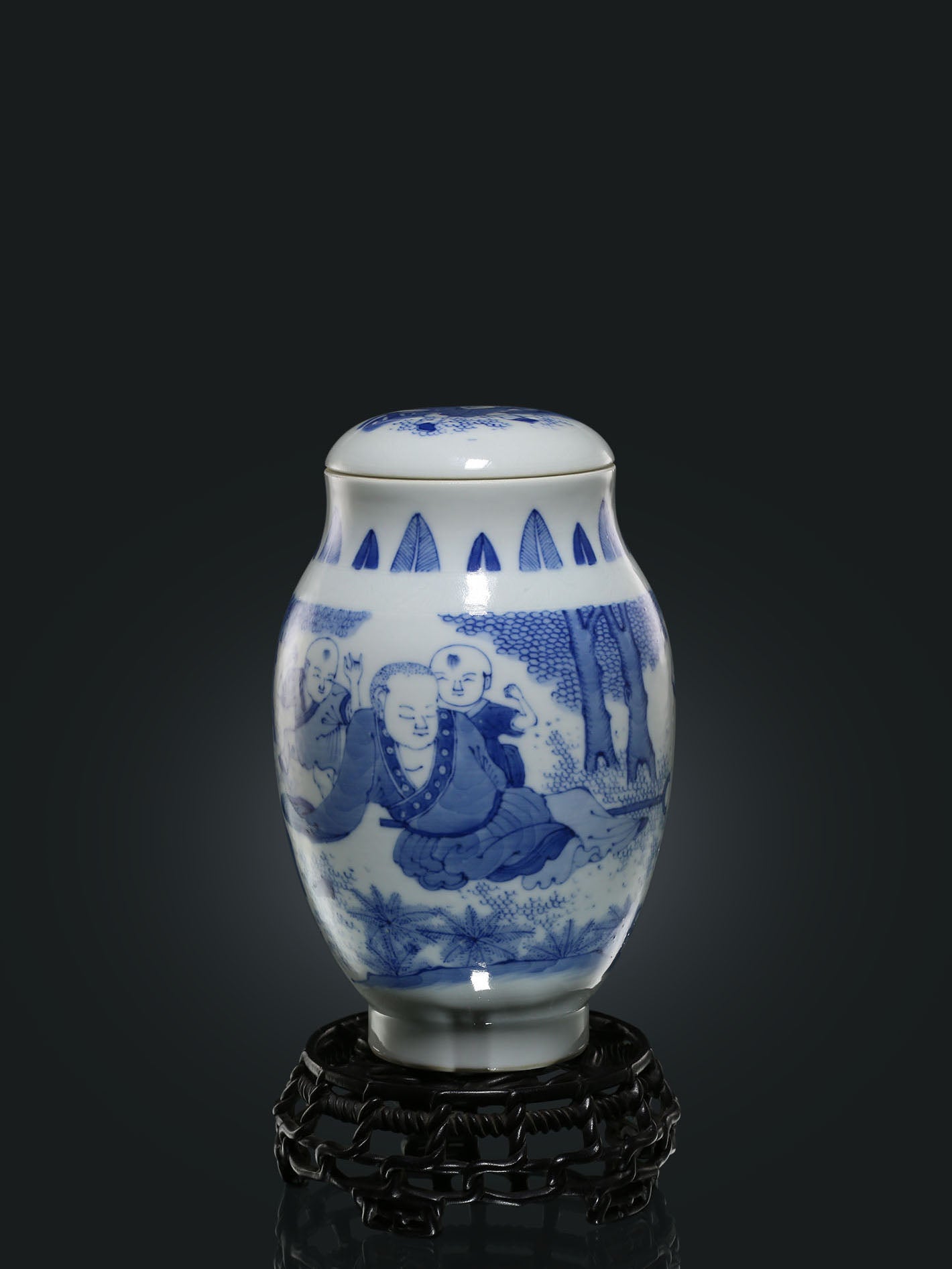 Blue and white porcelain tea canister with children playing design