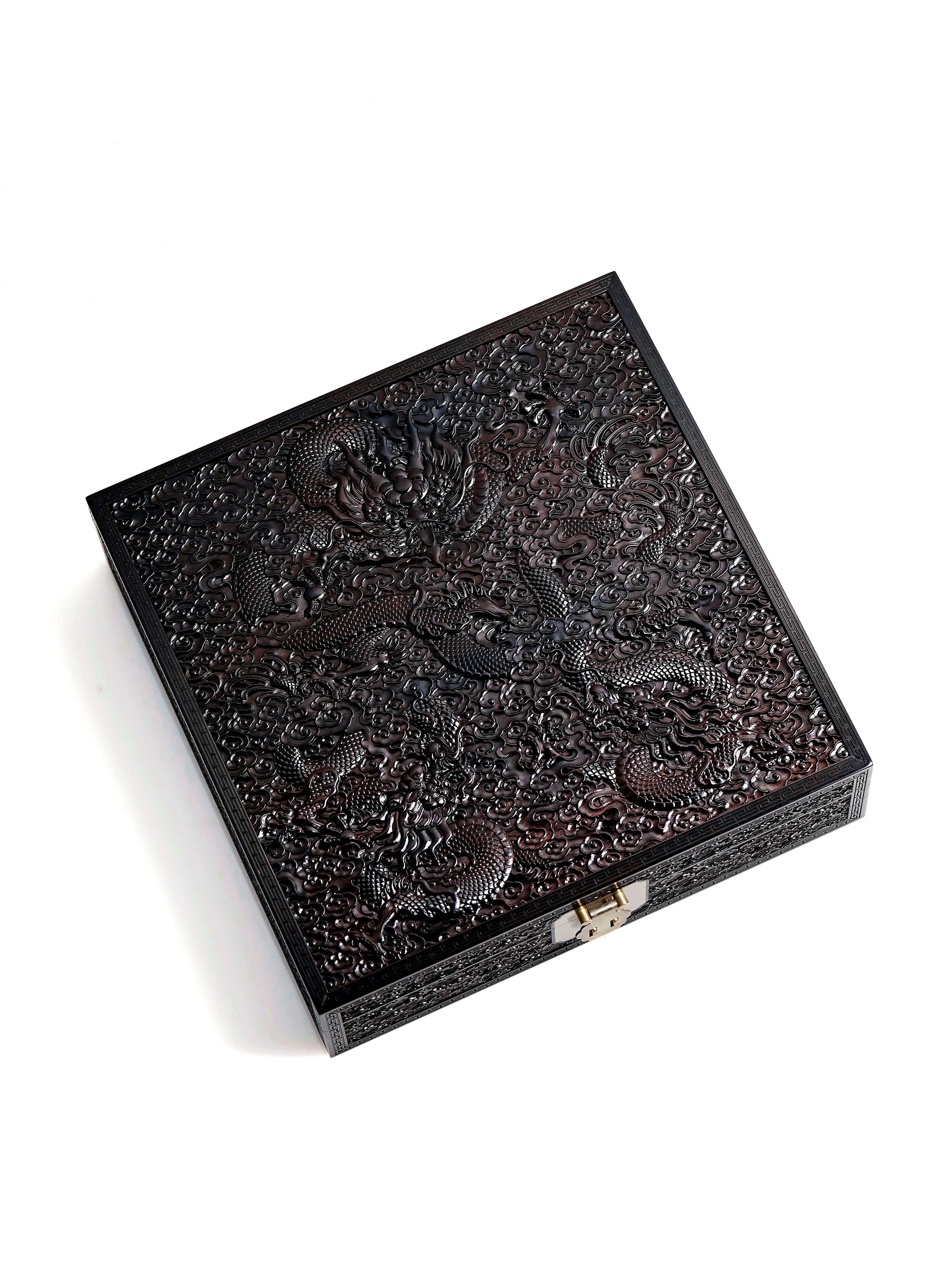 Purple sandalwood tea box with dragon carvings covering thousands of miles