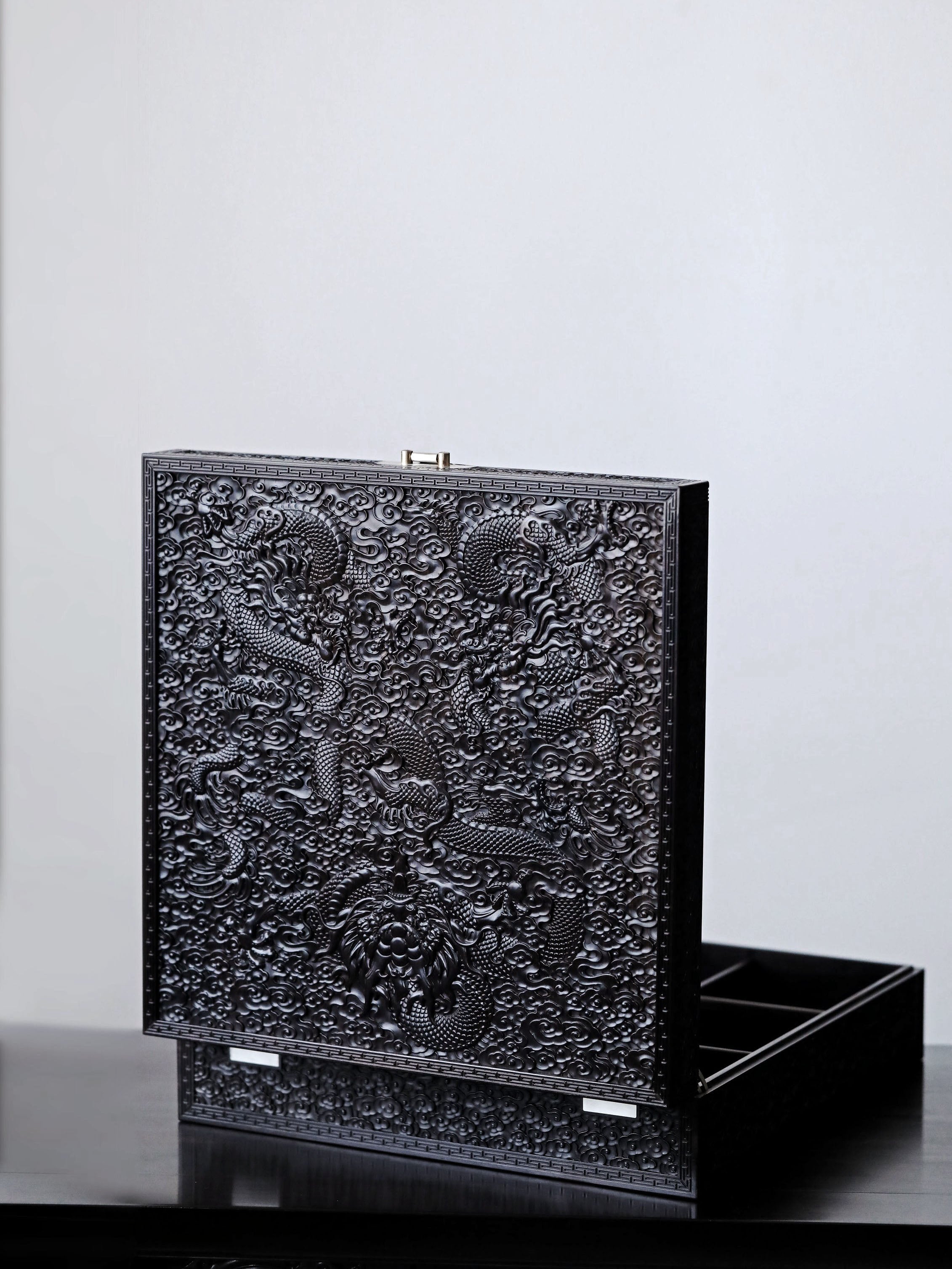 Purple sandalwood tea box with dragon carvings covering thousands of miles