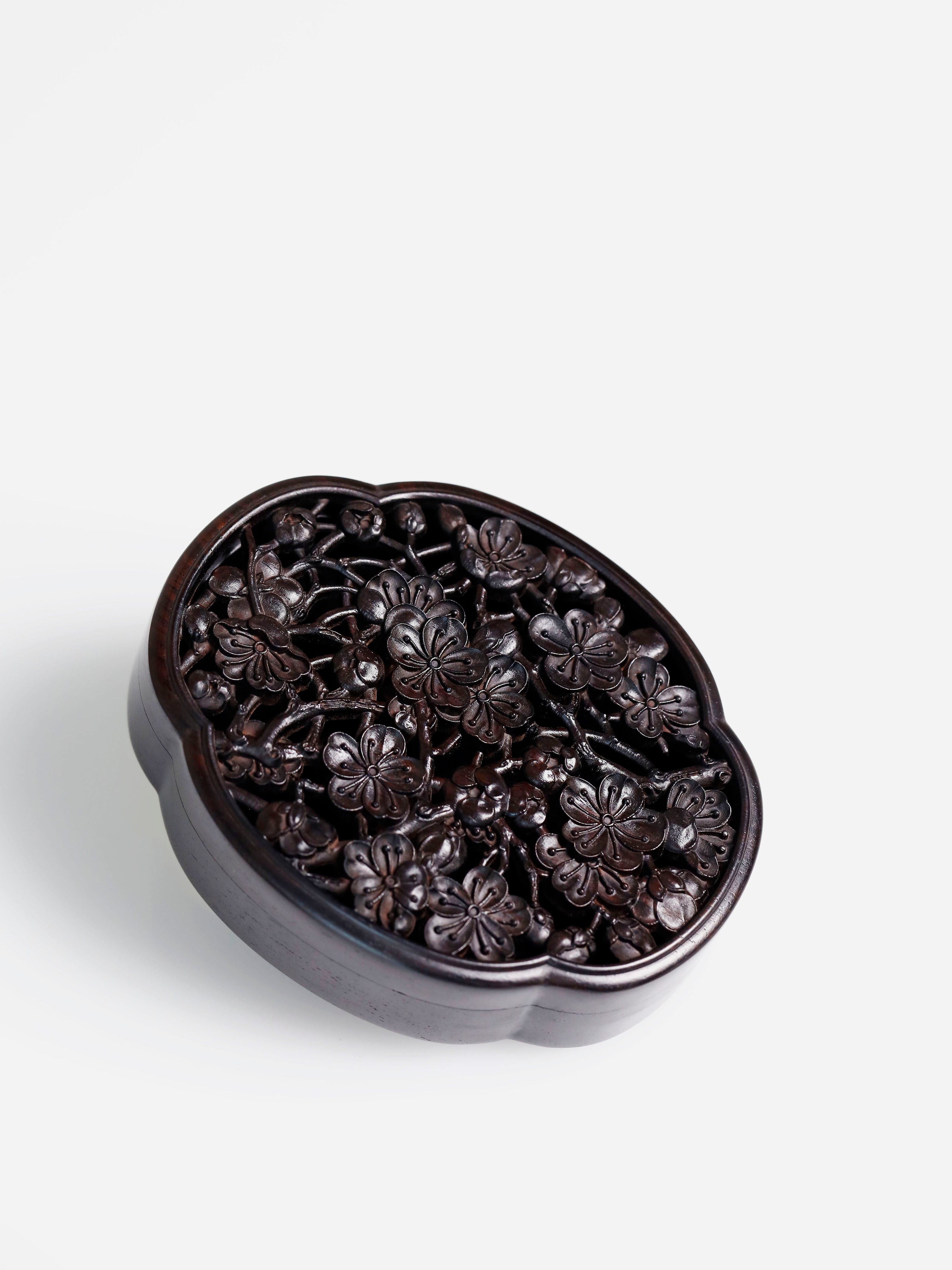 Purple sandalwood hollowed-out plum blossom shaped solid wood incense box