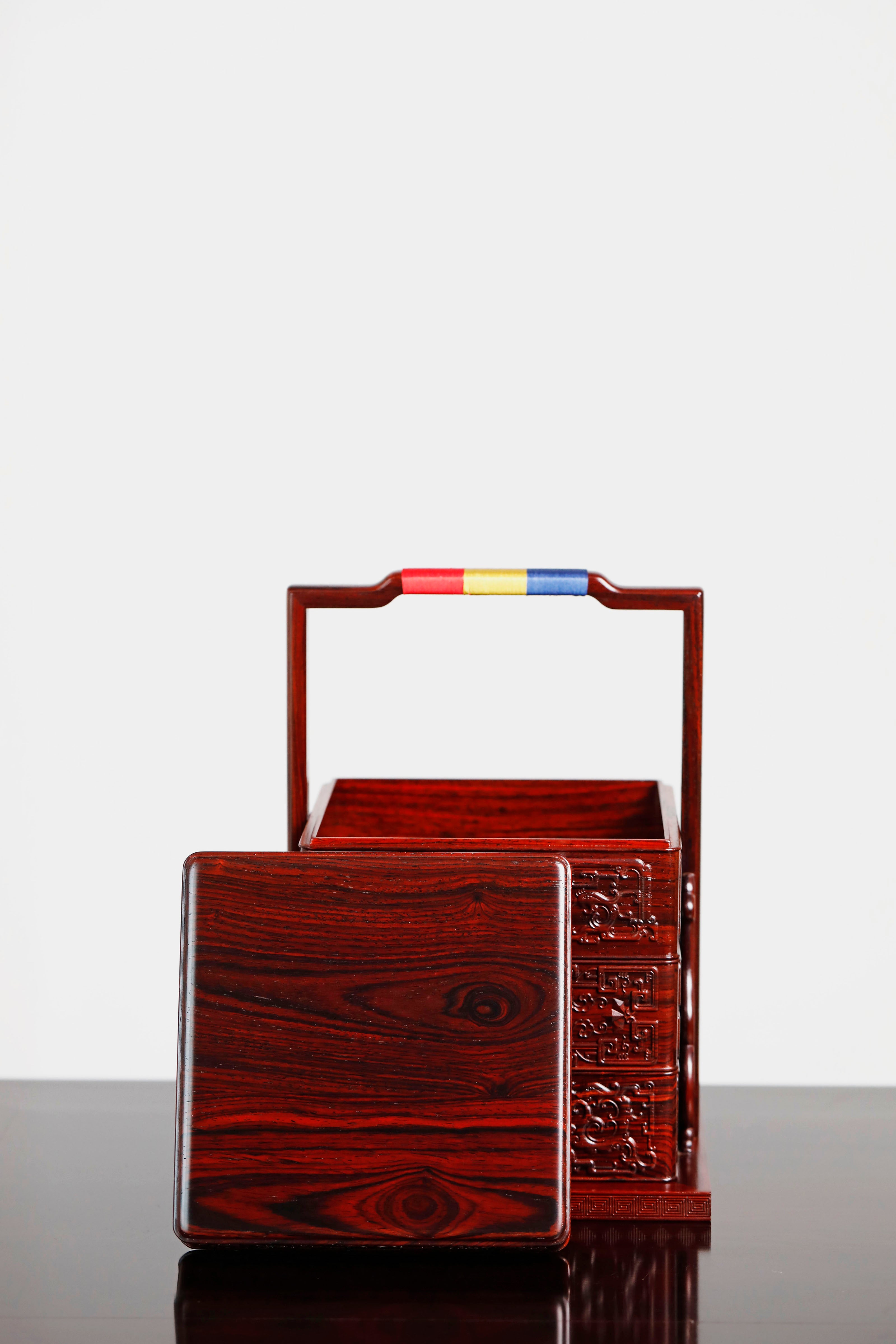 Rosewood square box with carved dragon and phoenix patterns