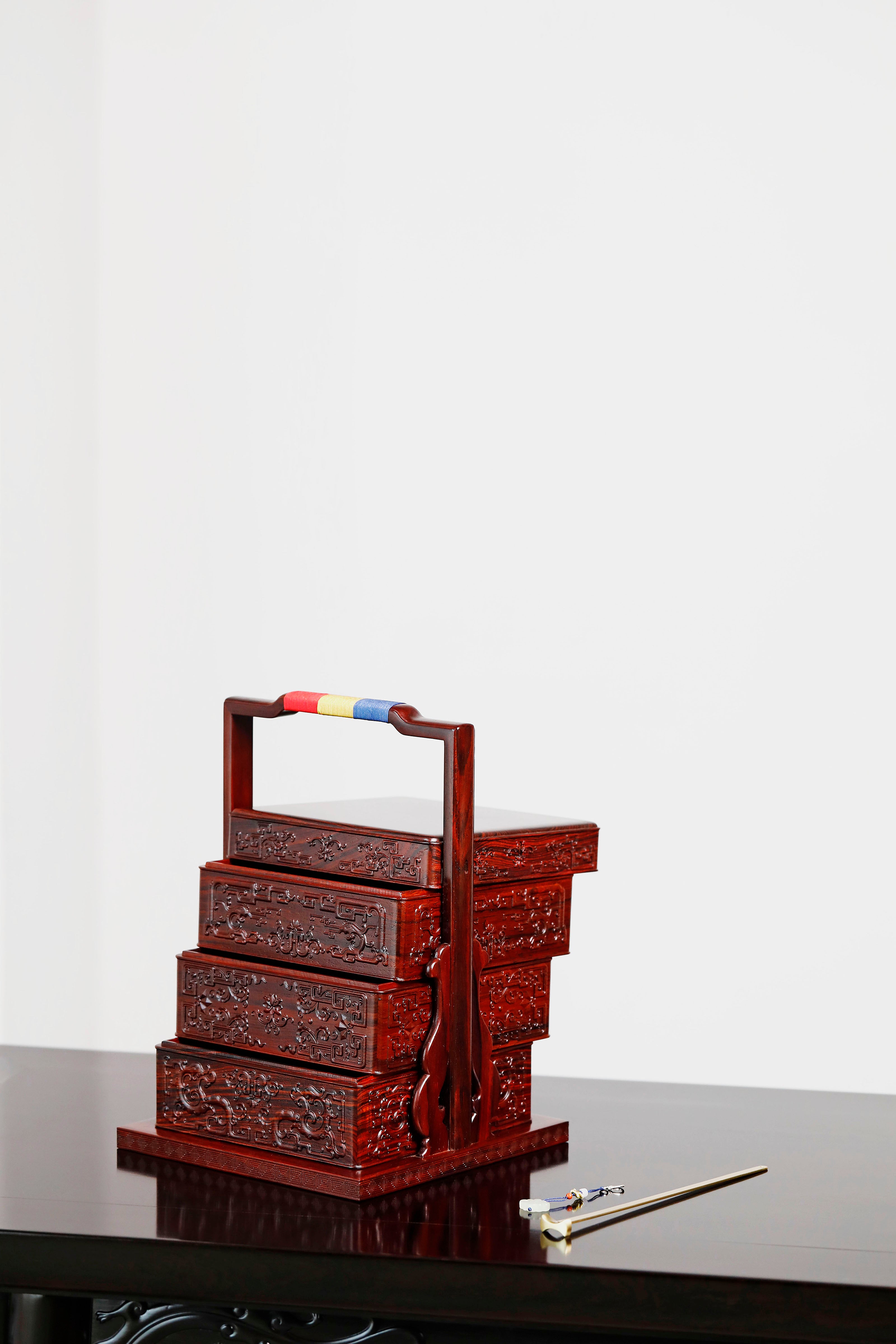 Rosewood square box with carved dragon and phoenix patterns