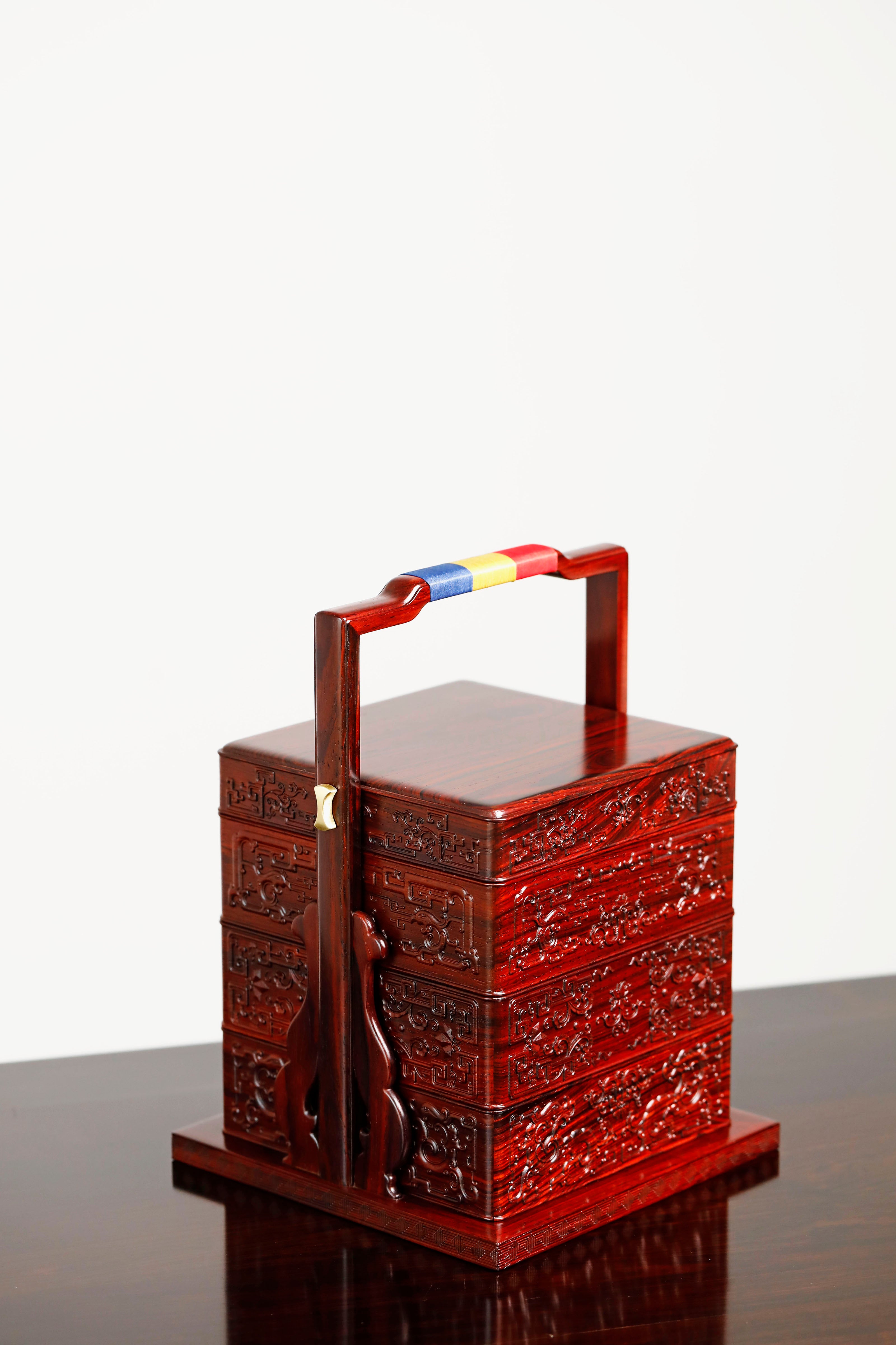 Rosewood square box with carved dragon and phoenix patterns