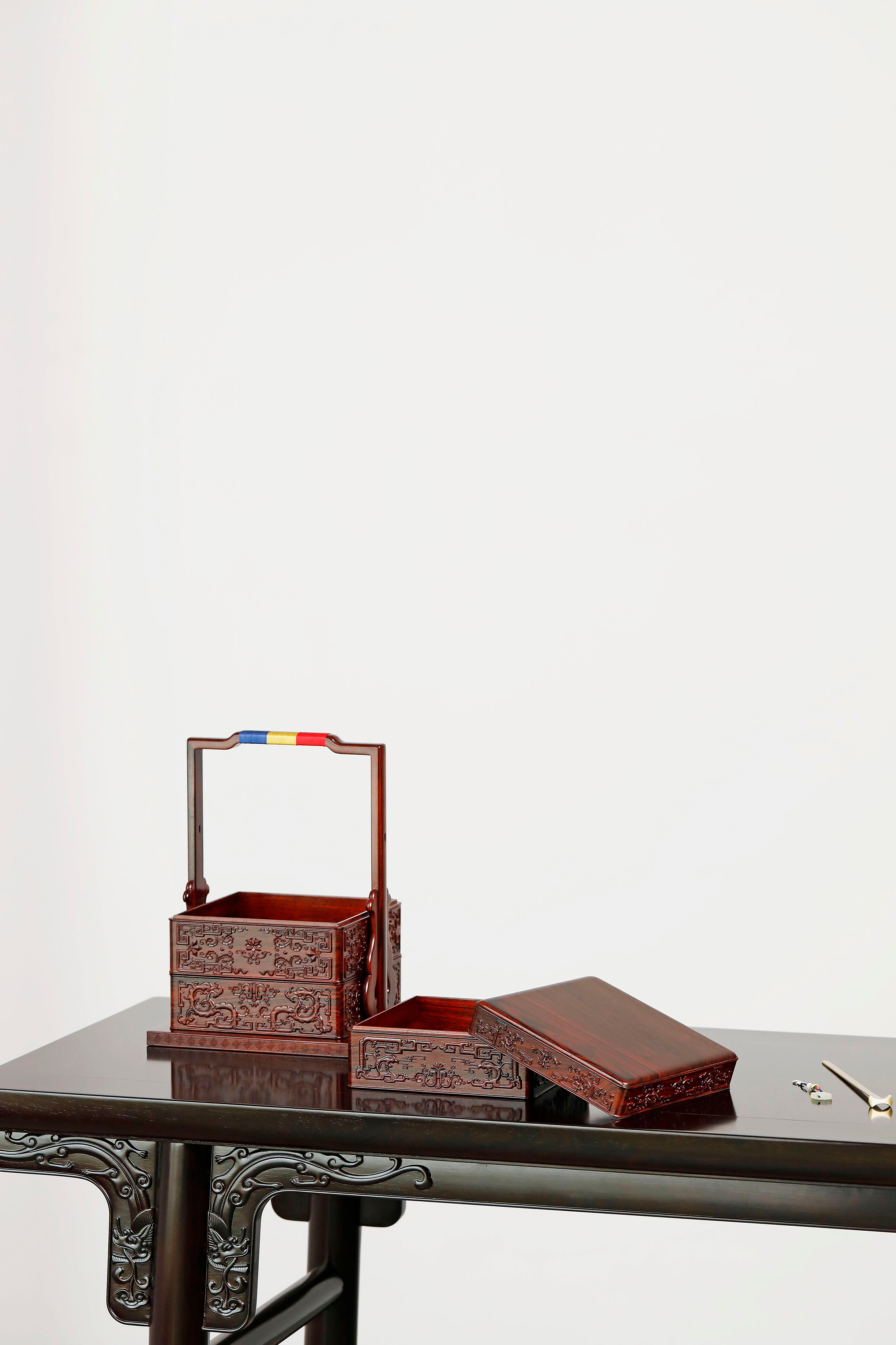 Rosewood square box with carved dragon and phoenix patterns