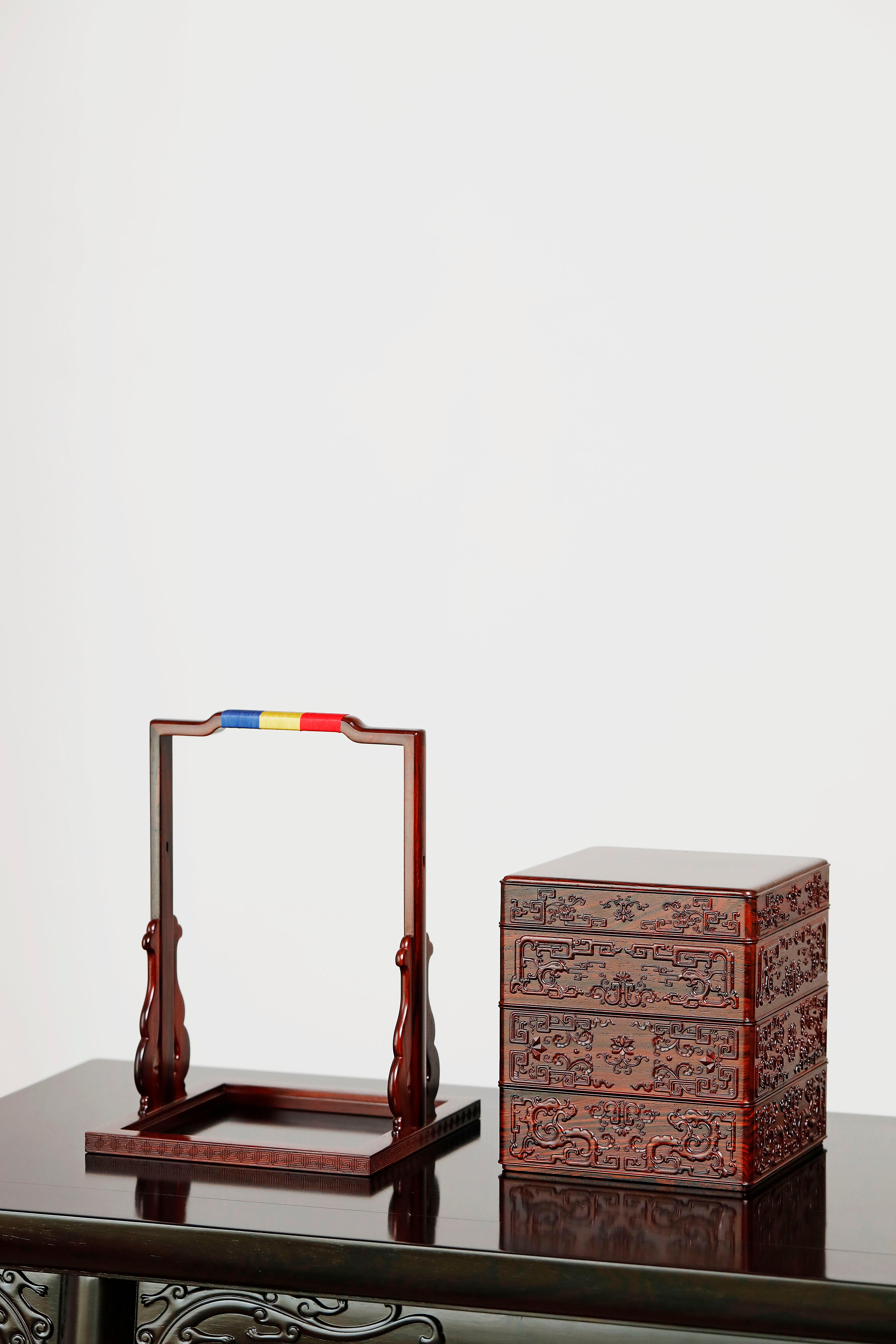 Rosewood square box with carved dragon and phoenix patterns