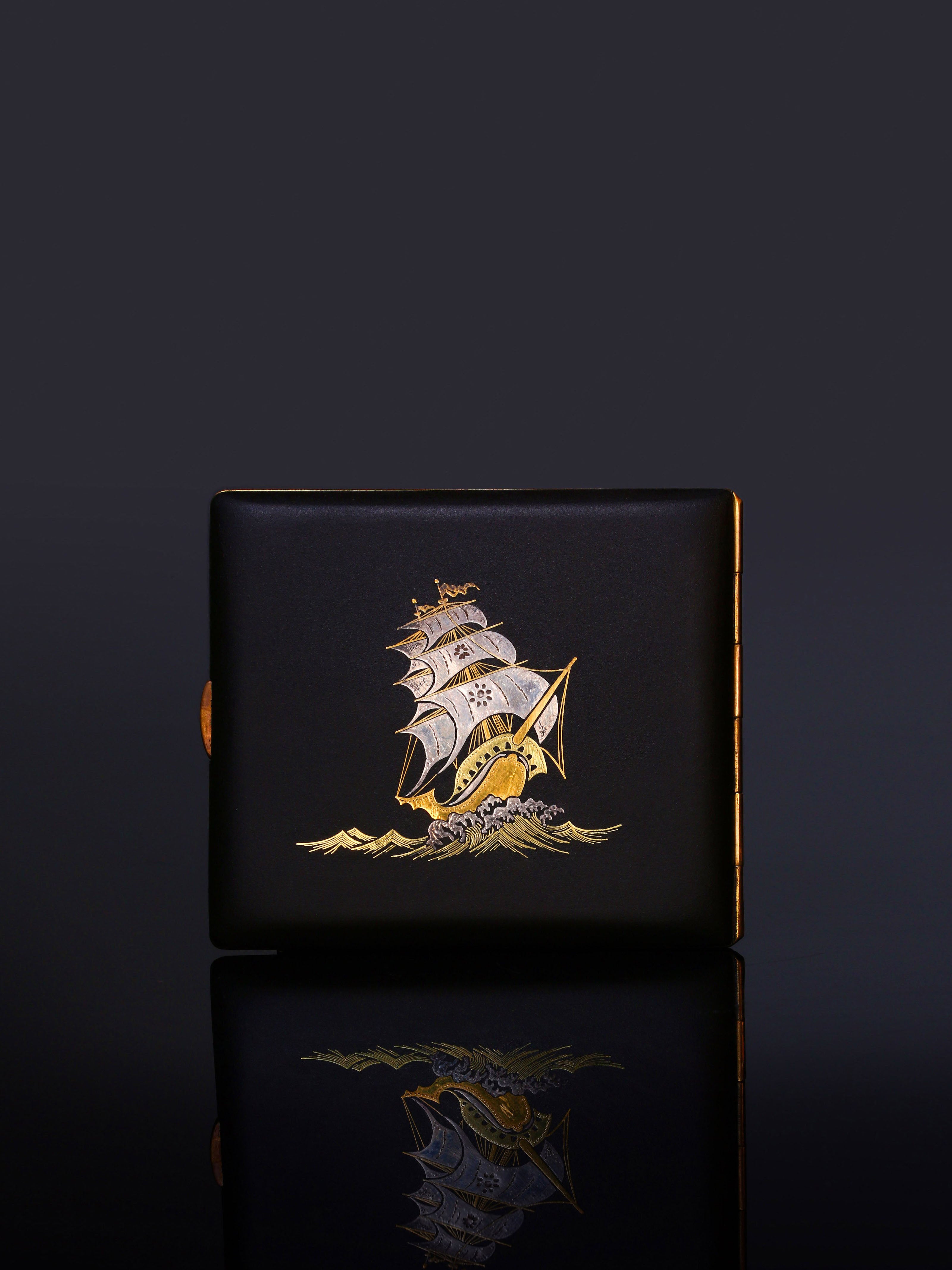 Iron-cut gold "Full Load Return" cigarette box