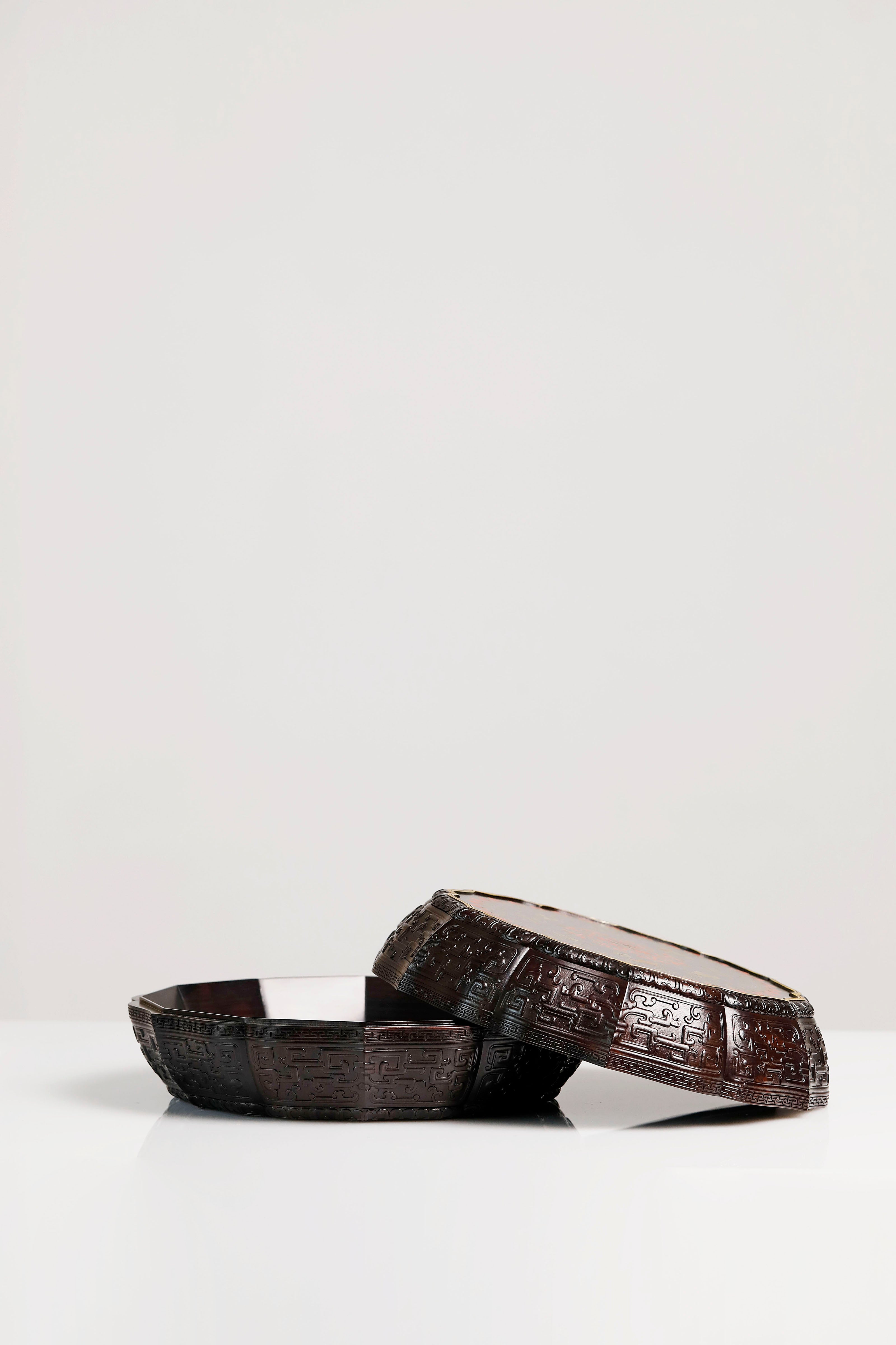 Purple sandalwood twelve-cornered fruit box with gilded Eight Immortals design and sunflower-shaped opening.