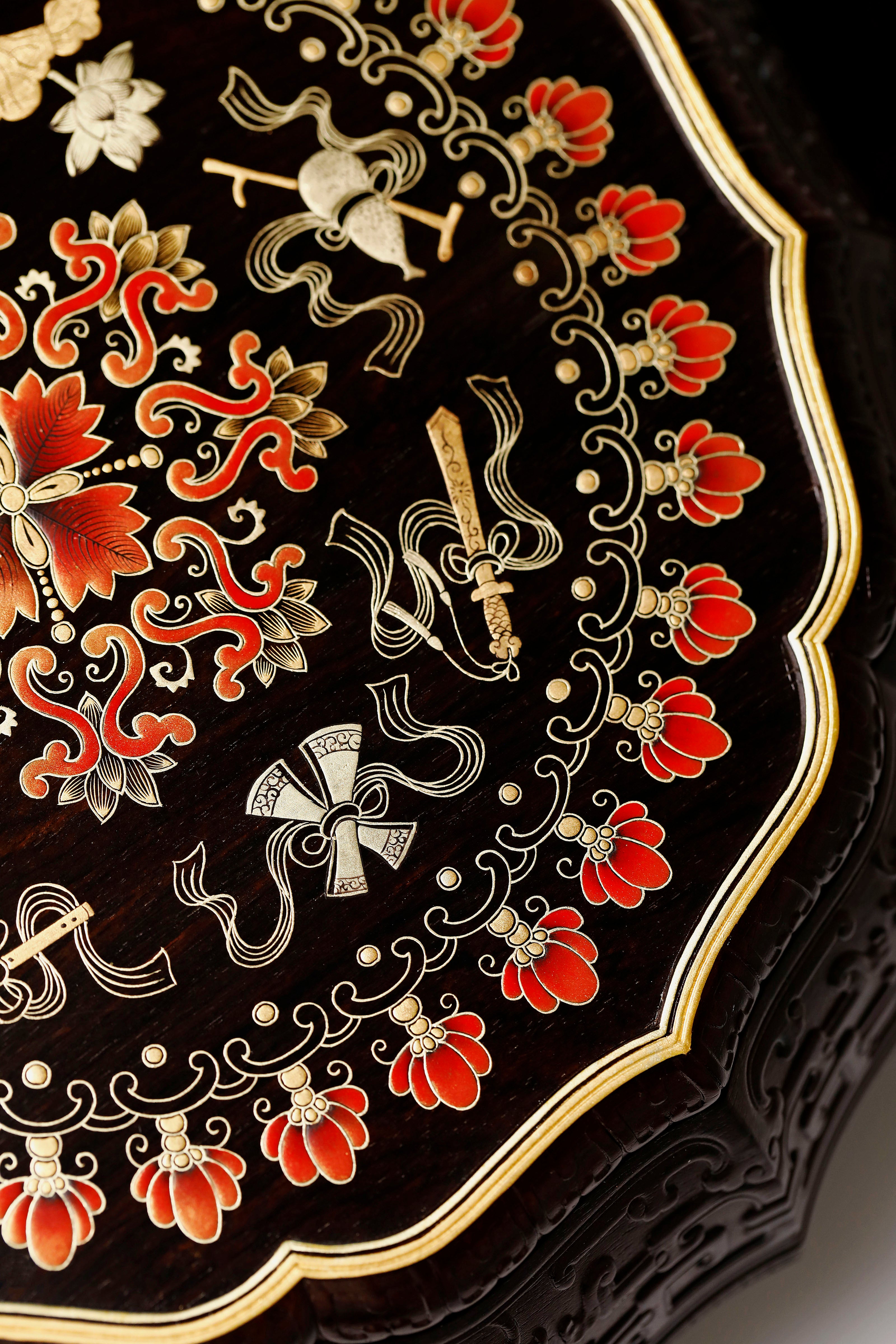 Purple sandalwood twelve-cornered fruit box with gilded Eight Immortals design and sunflower-shaped opening.