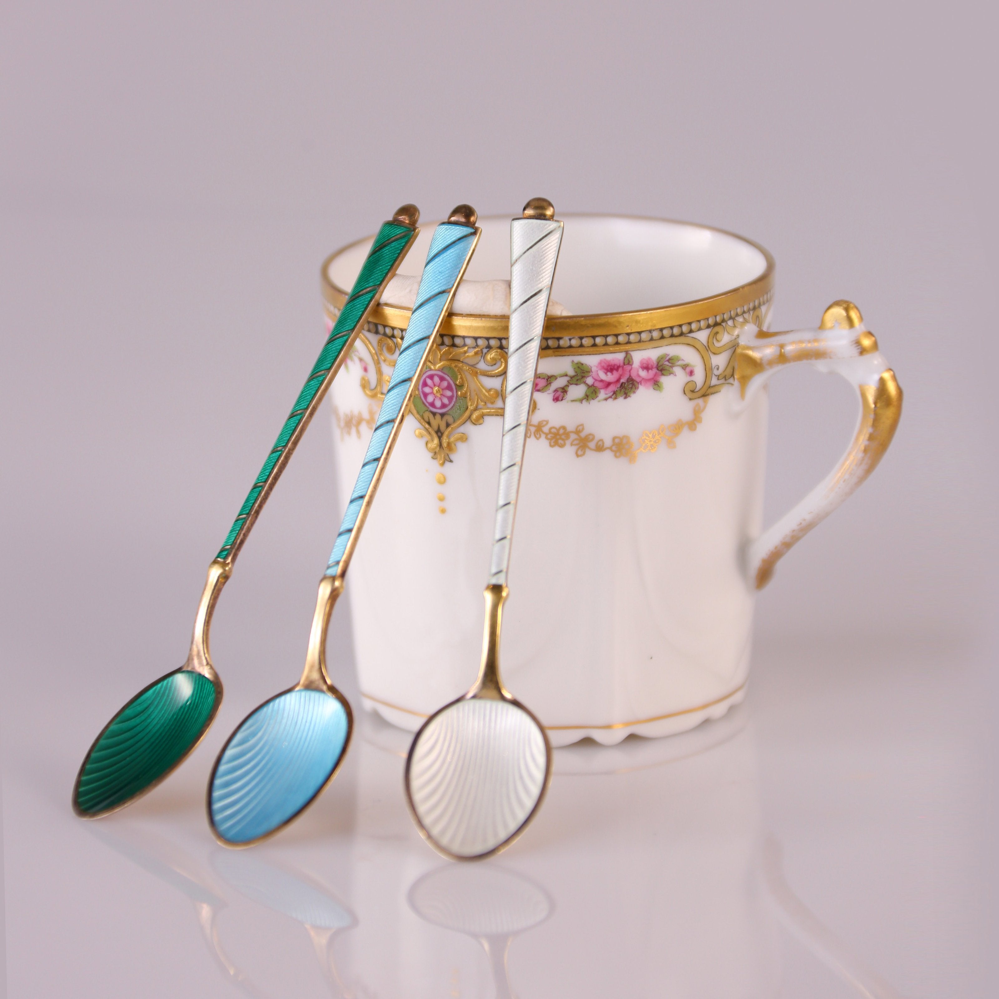 Six antique British sterling silver gilt enamel spoons / Six sets of 19th-century French gilt floral teacups (including saucers)