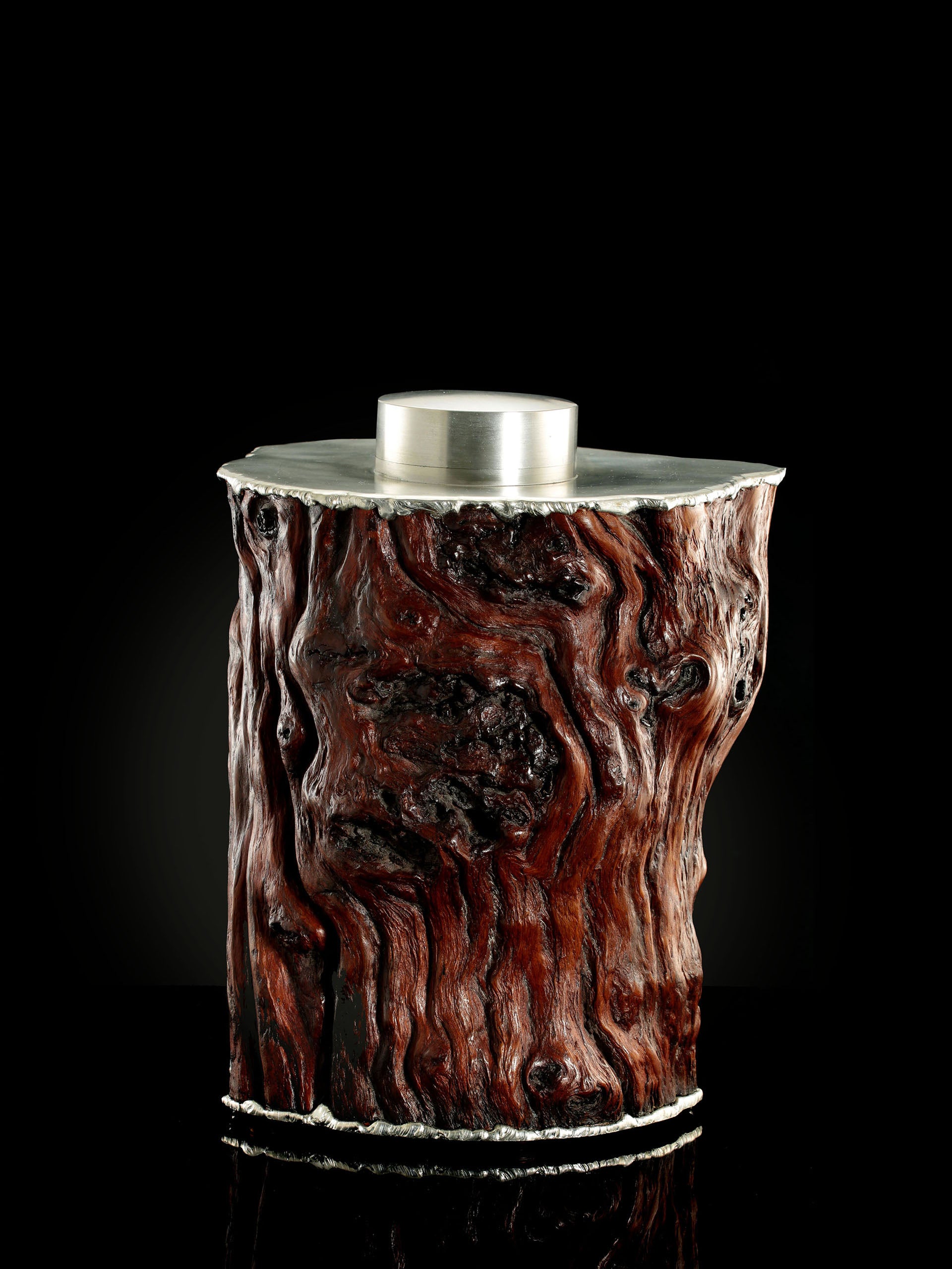 Curved and rugged tin-carved burl wood tea canister
