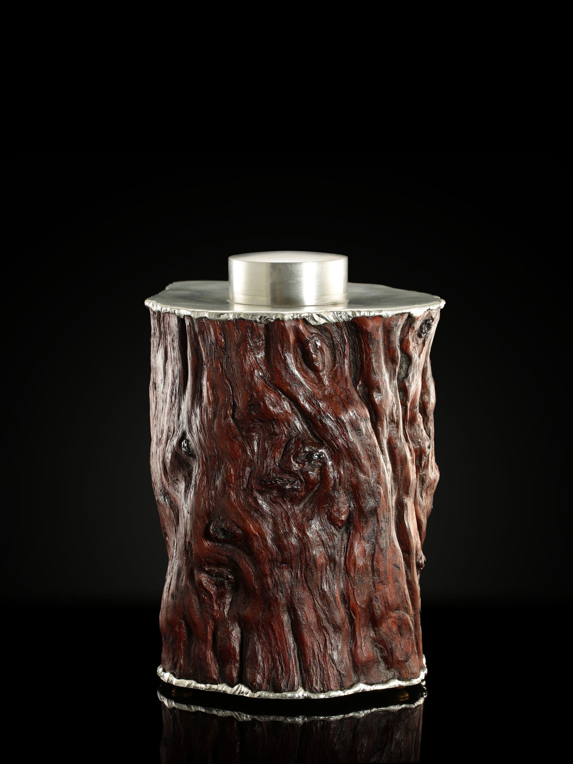 Curved and rugged tin-carved burl wood tea canister