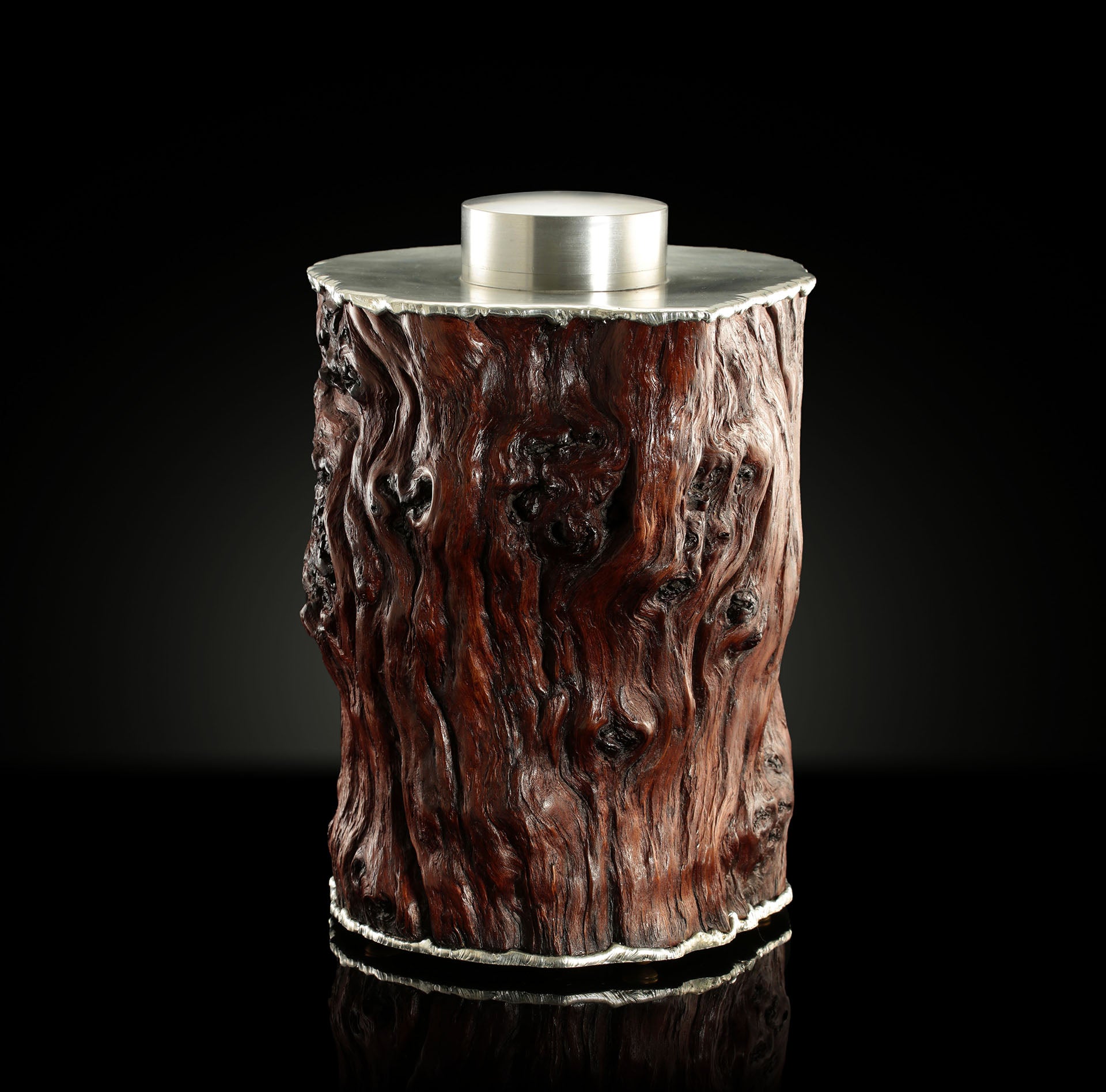 Curved and rugged tin-carved burl wood tea canister