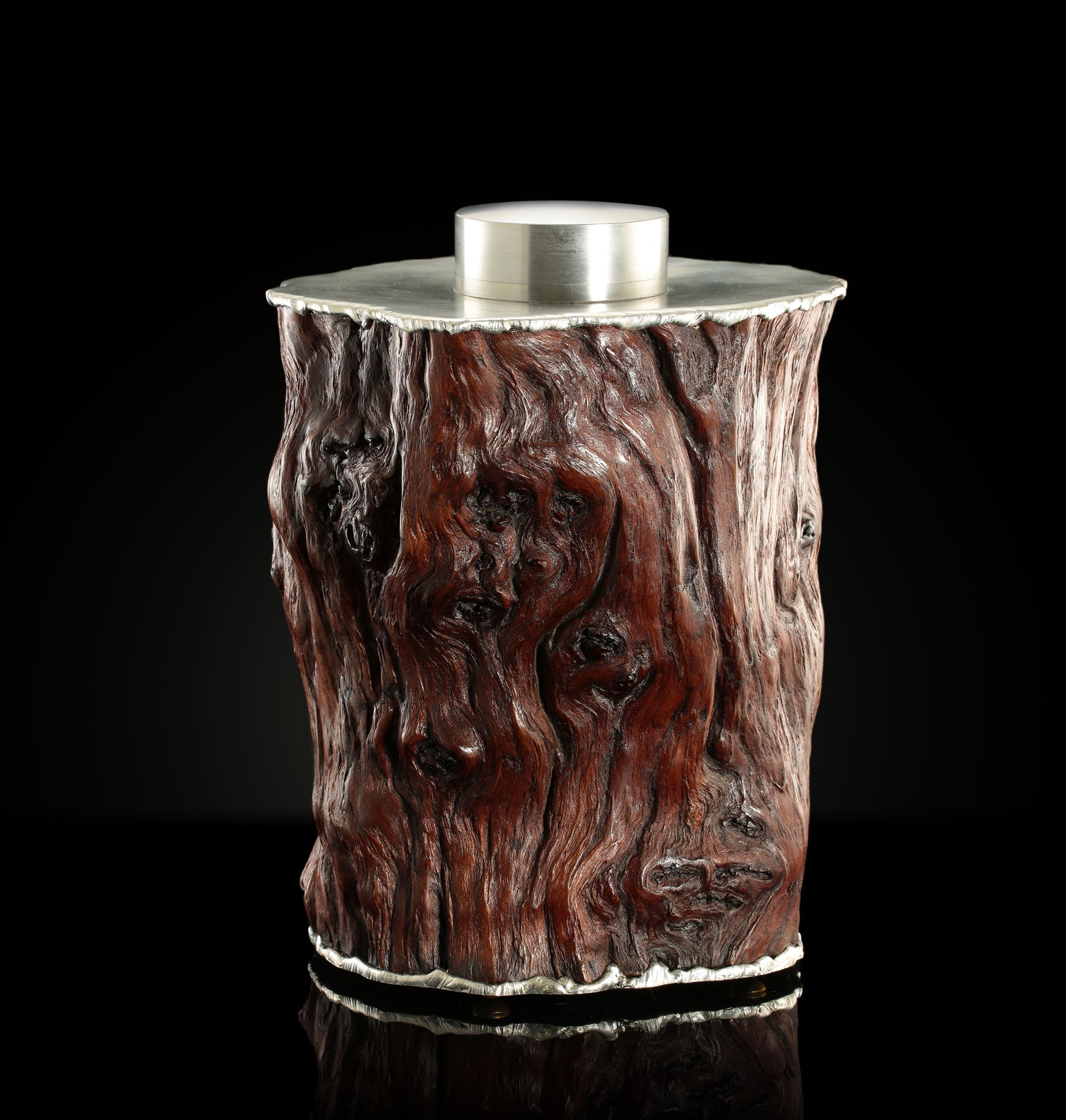 Curved and rugged tin-carved burl wood tea canister
