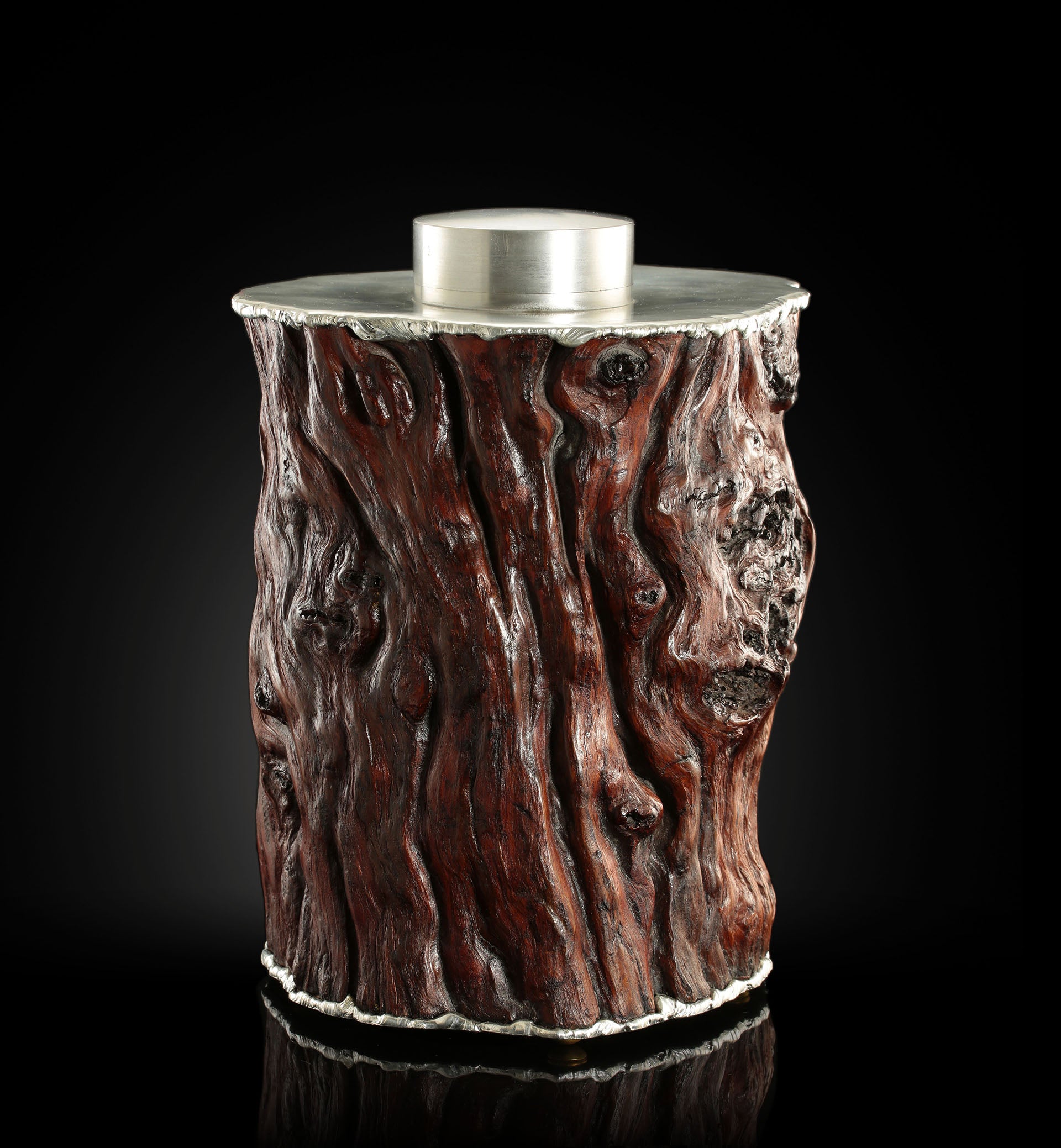Curved and rugged tin-carved burl wood tea canister