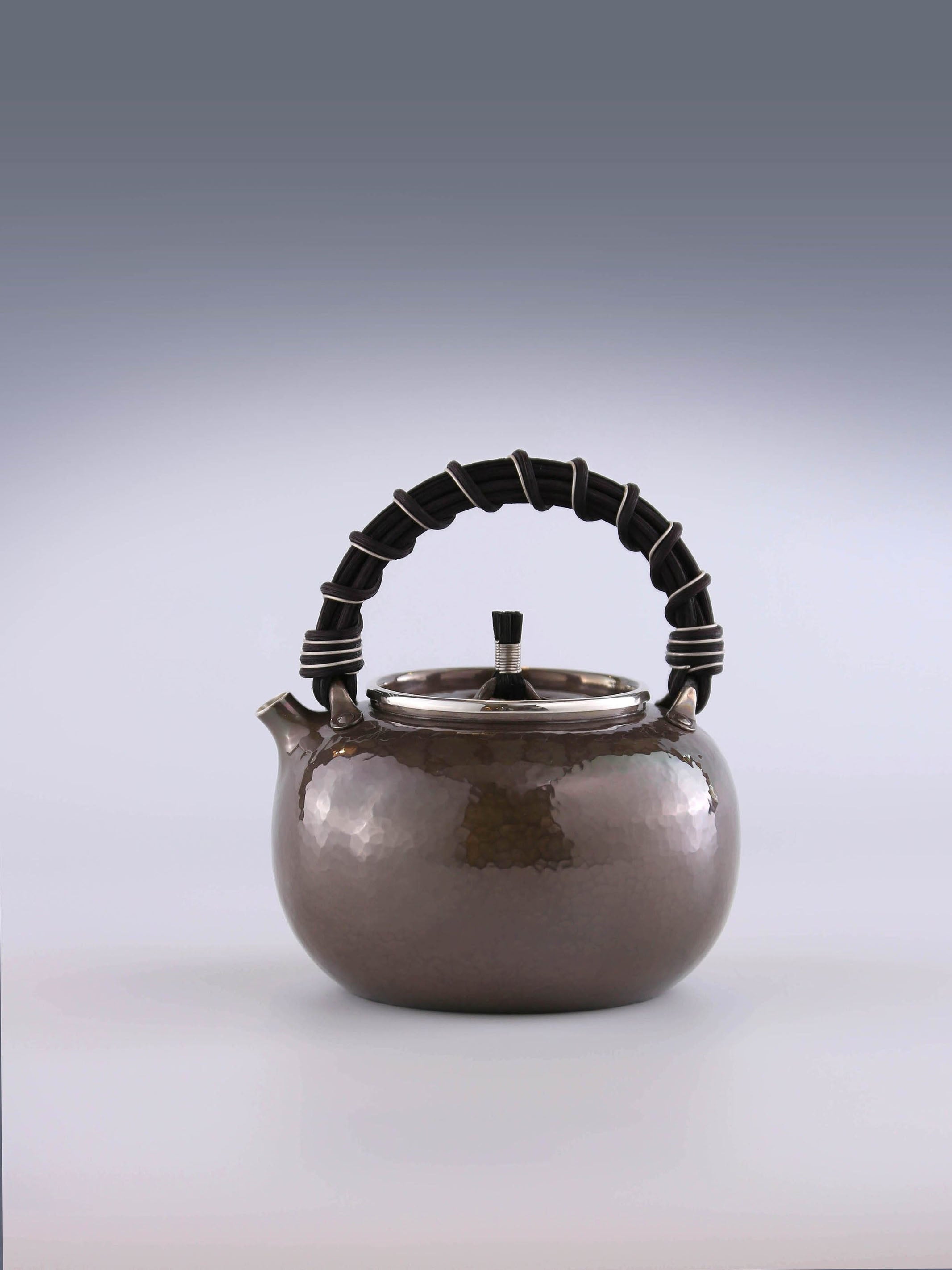 Apple-shaped vine-handled silver teapot