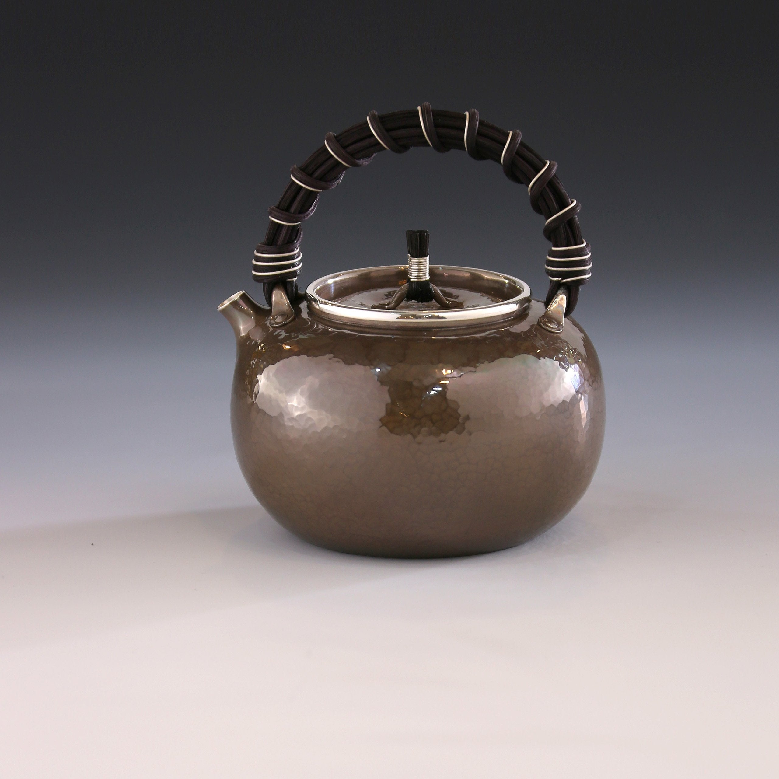 Apple-shaped vine-handled silver teapot