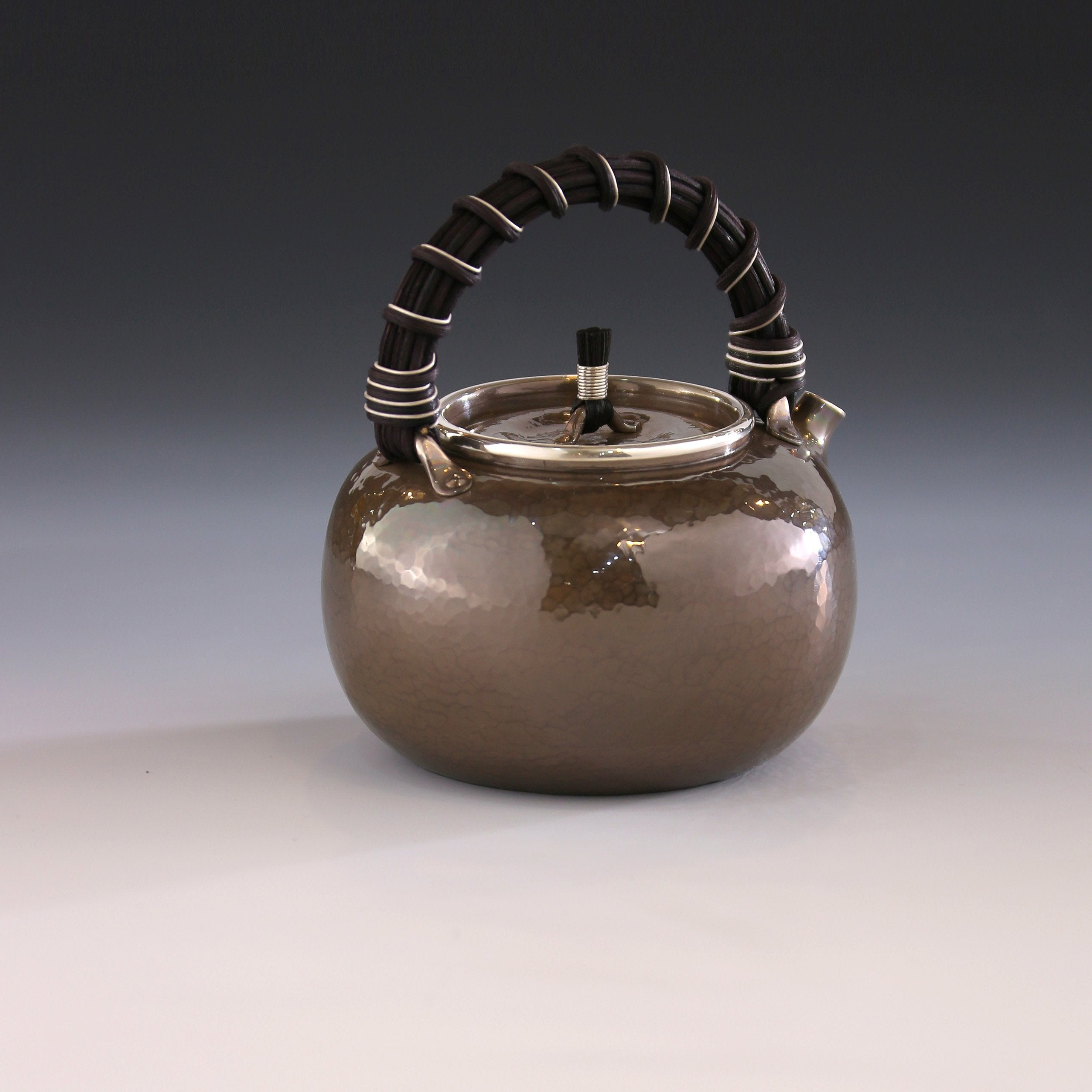 Apple-shaped vine-handled silver teapot