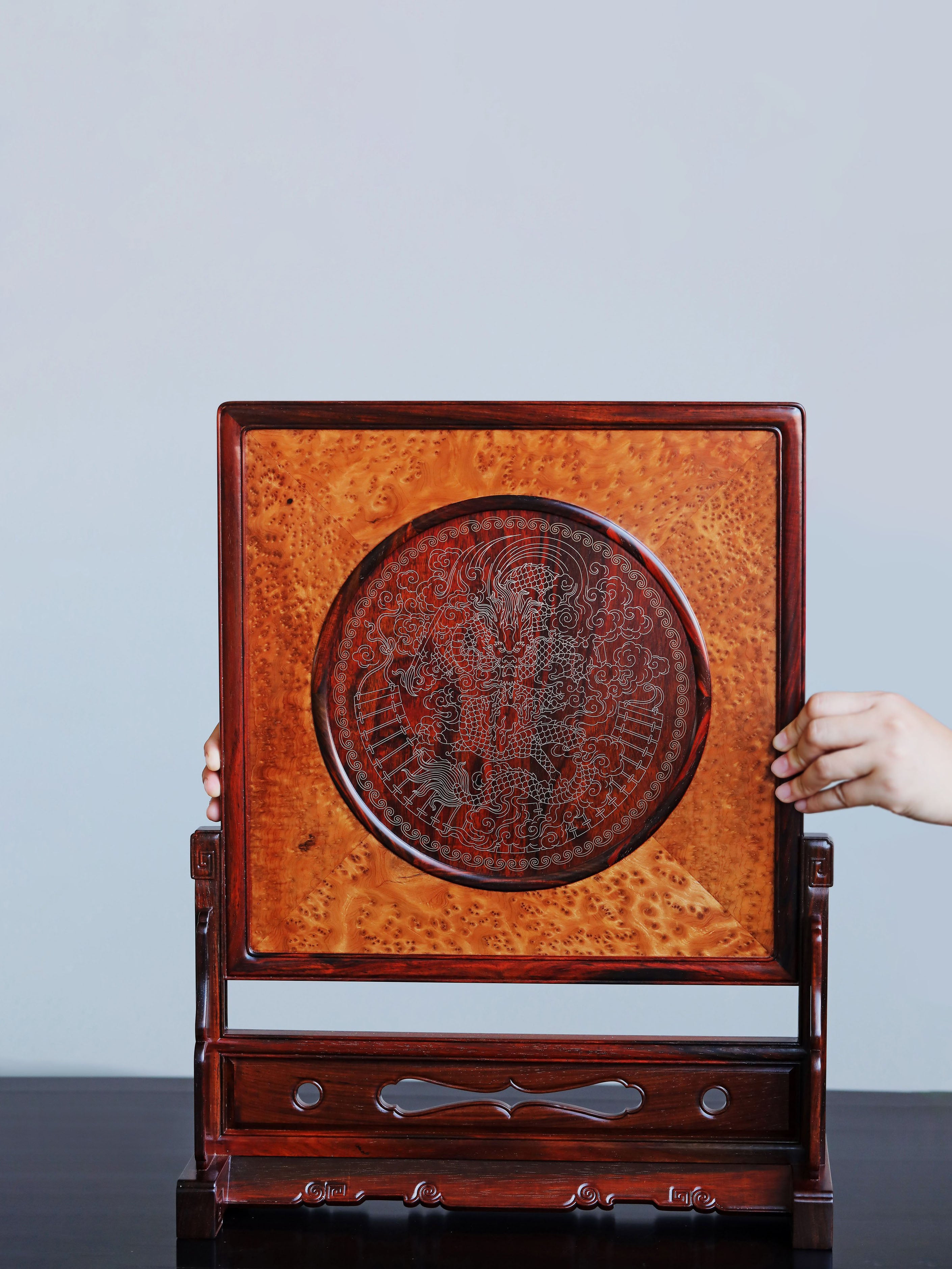 Rosewood screen inlaid with silver dragon design