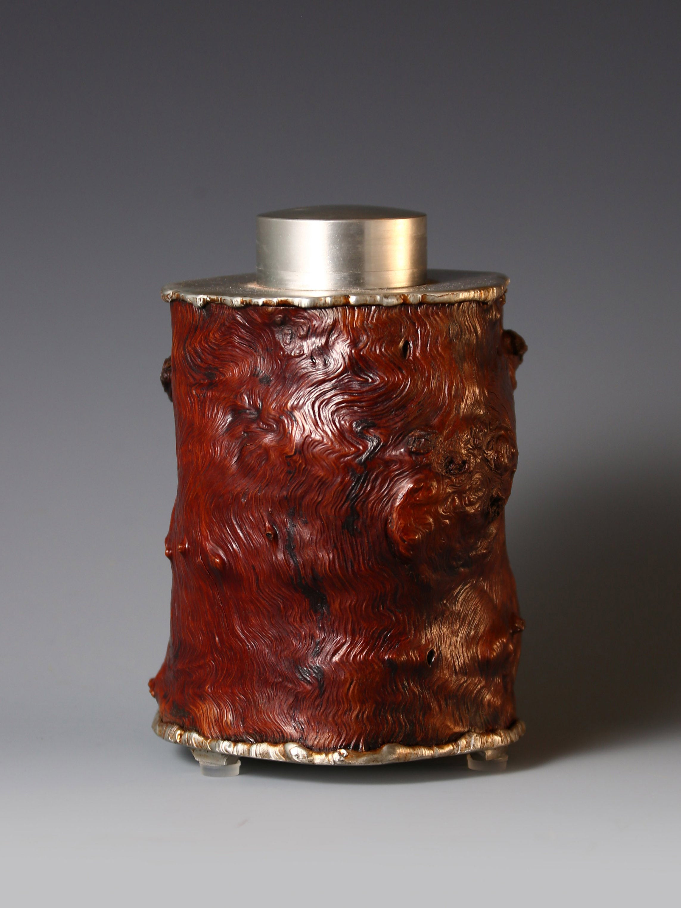 Strong and powerful tin-carved burl wood tea caddy