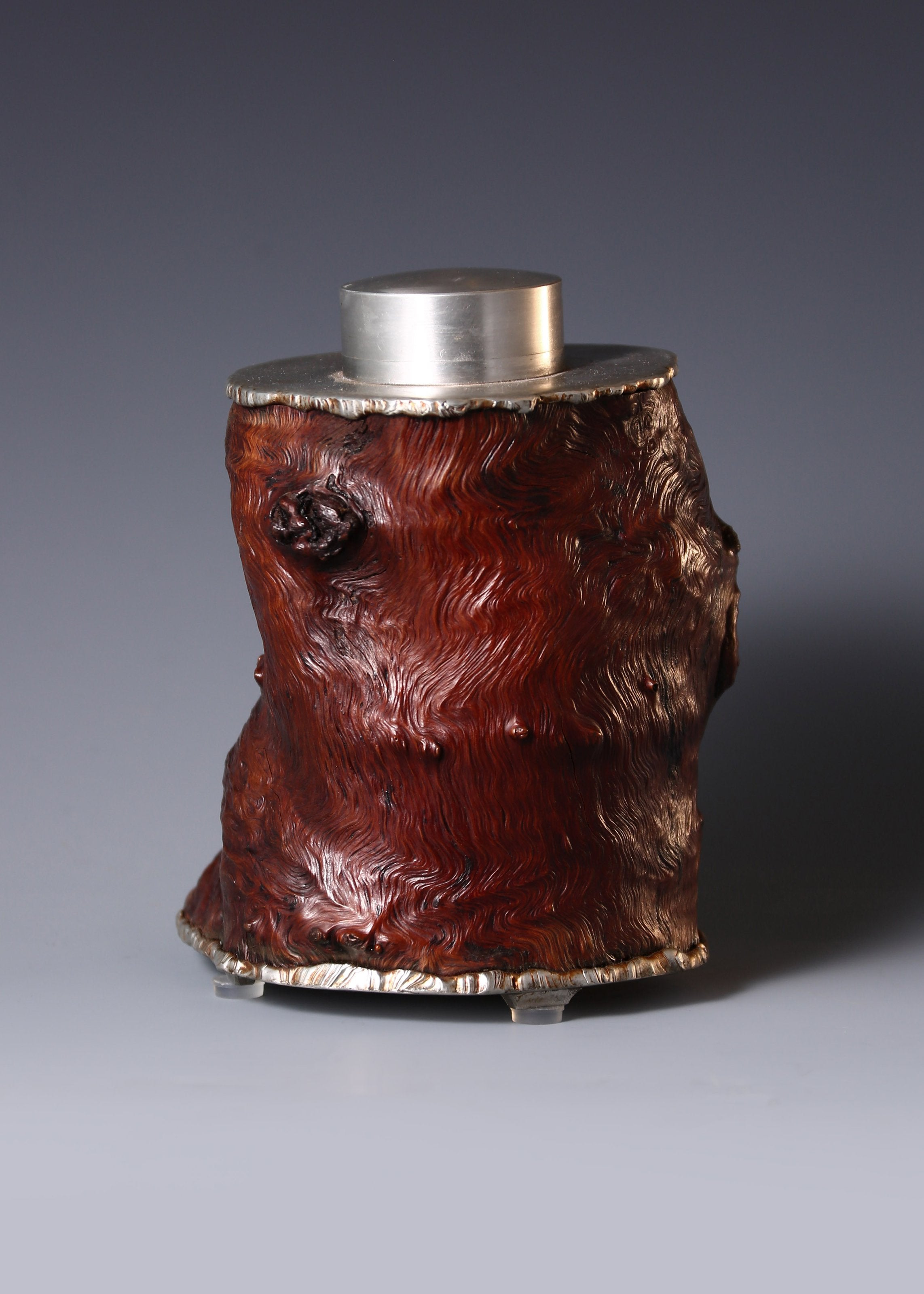 Strong and powerful tin-carved burl wood tea caddy