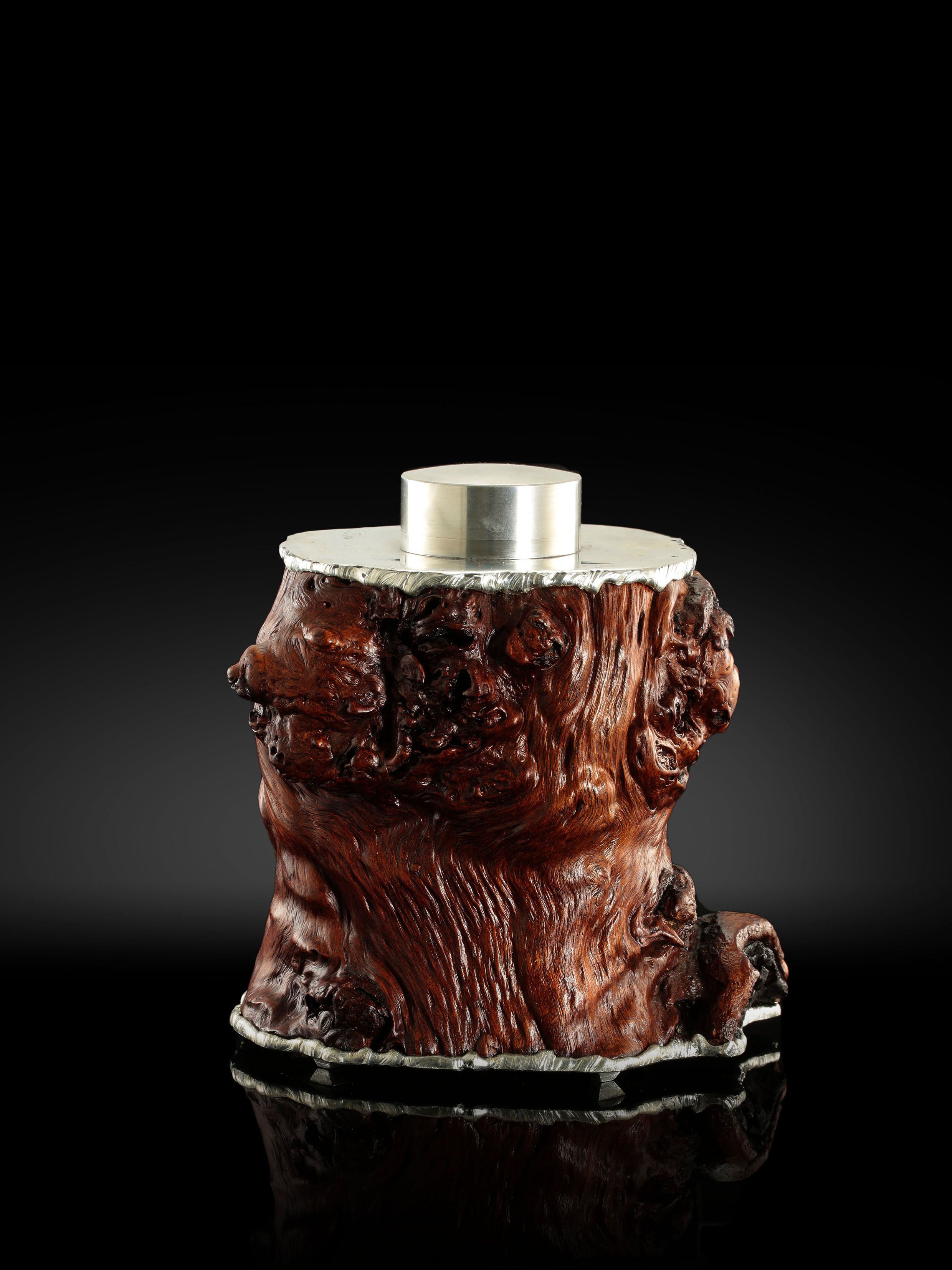 Gnarled branches and tin-carved burl wood tea caddy