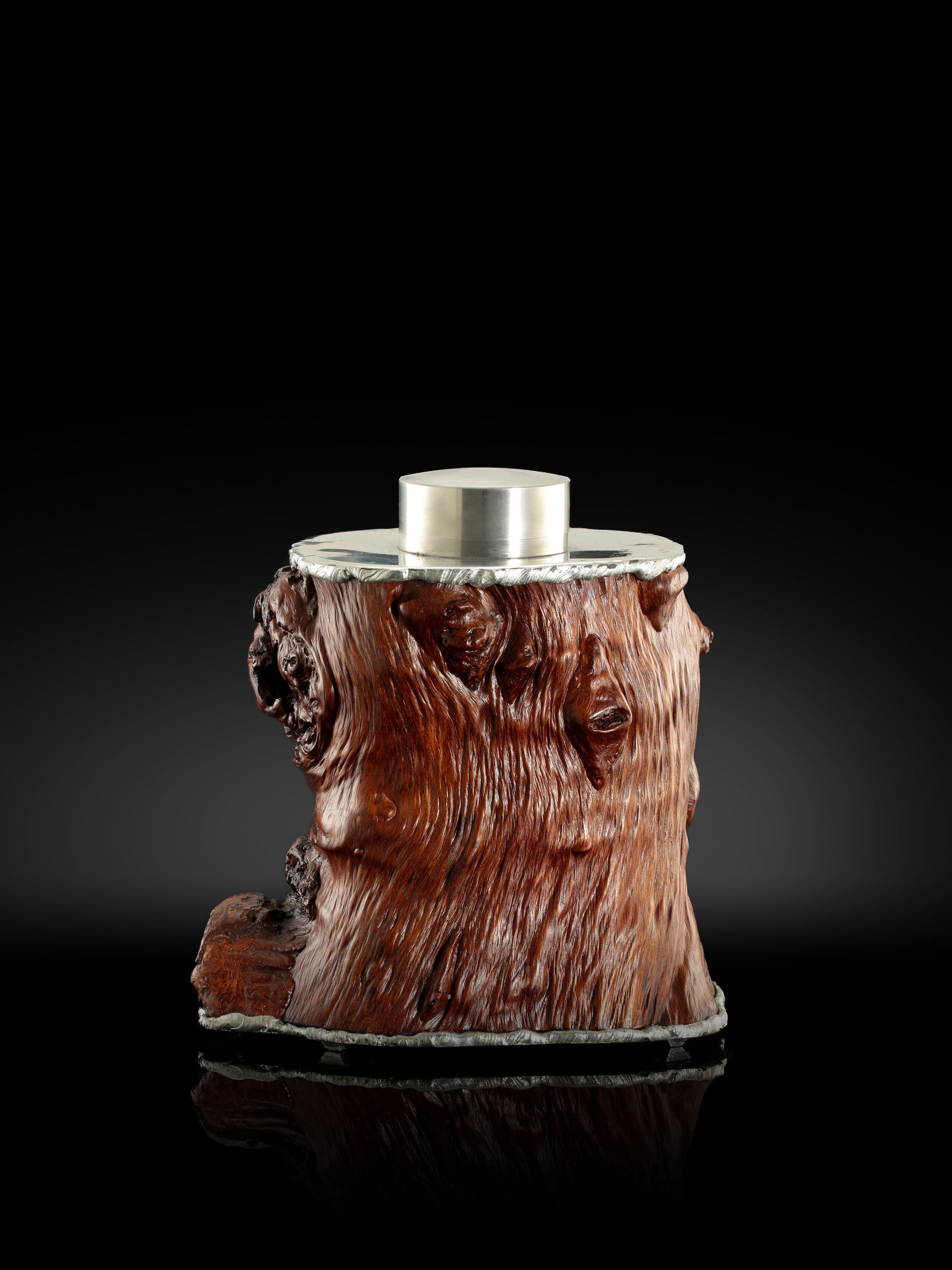 Gnarled branches and tin-carved burl wood tea caddy