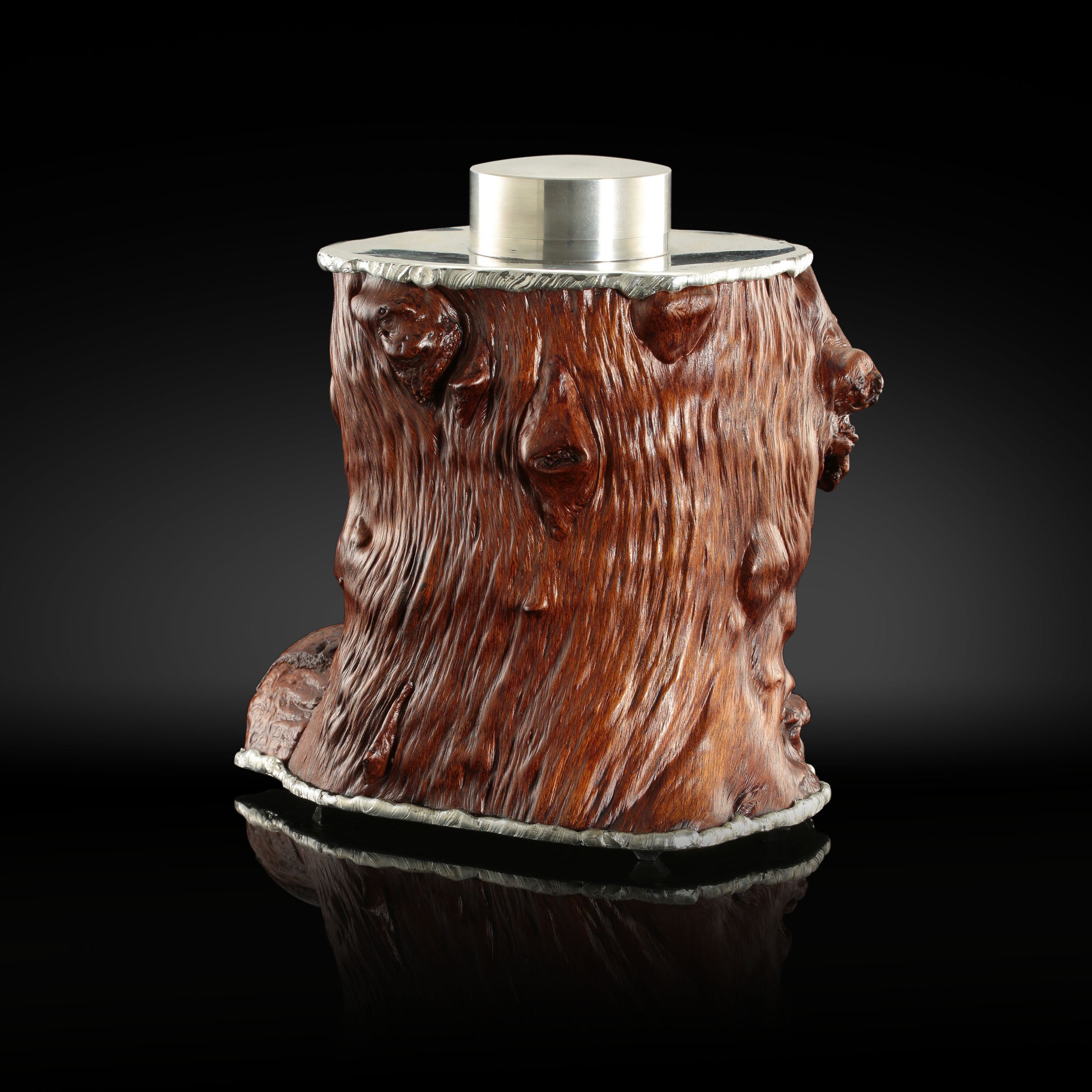 Gnarled branches and tin-carved burl wood tea caddy