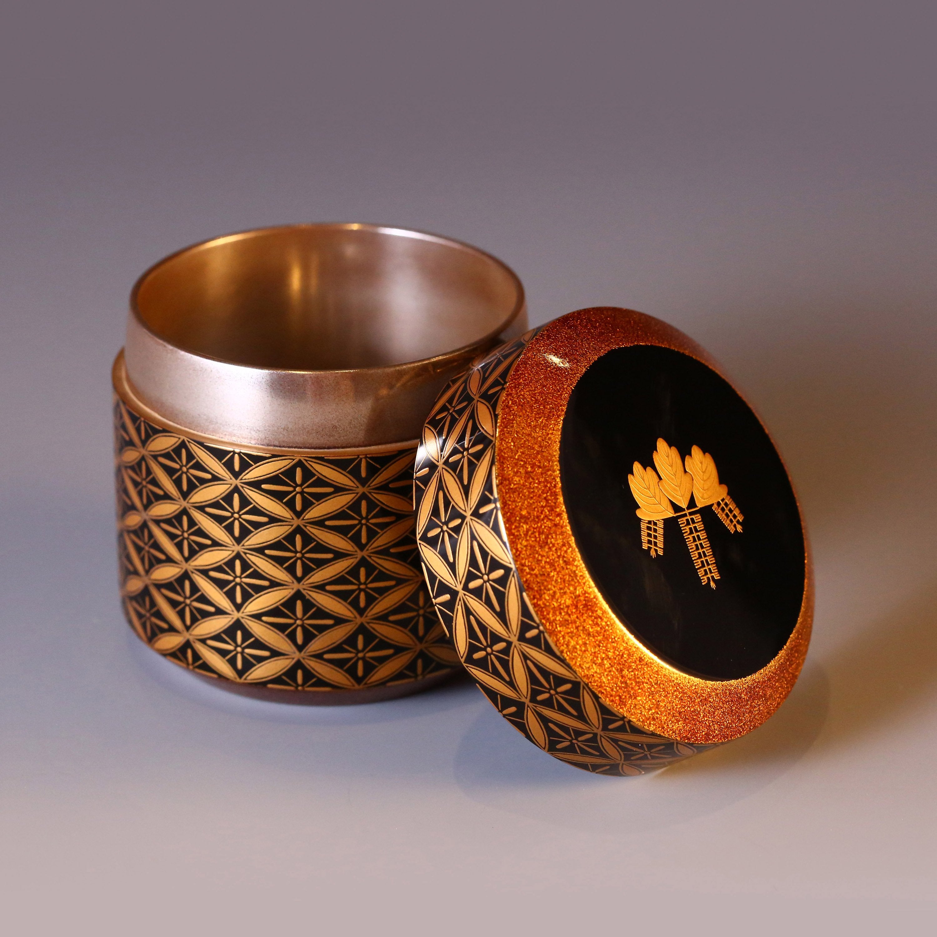 Japanese gold maki-e (a type of embroidery) with seven treasures and snow-blown dates.