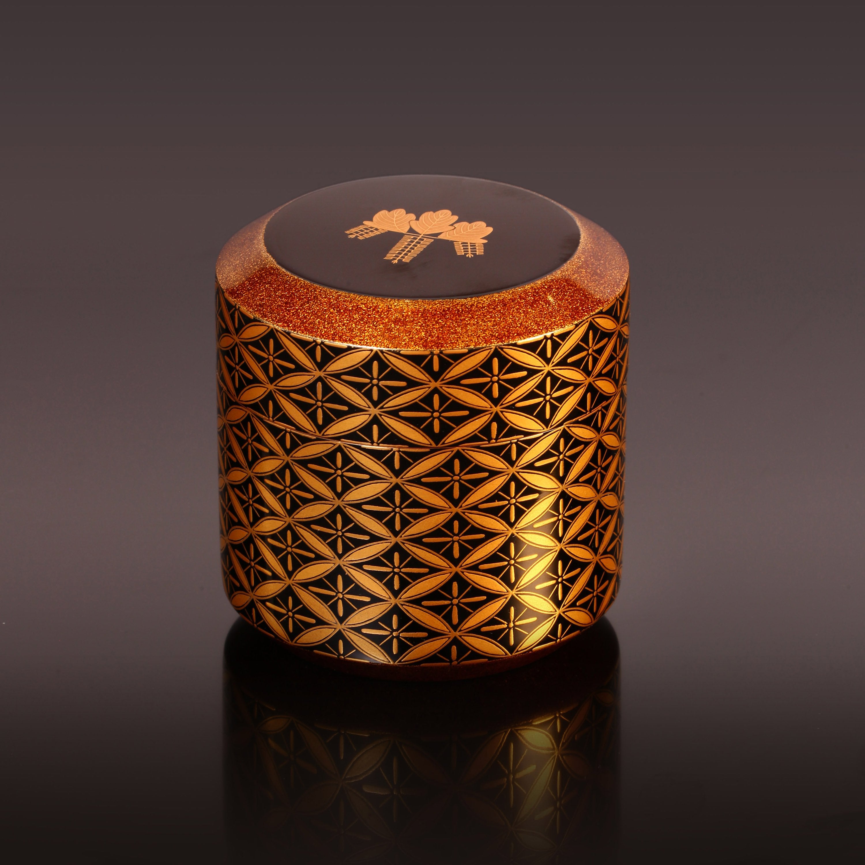 Japanese gold maki-e (a type of embroidery) with seven treasures and snow-blown dates.